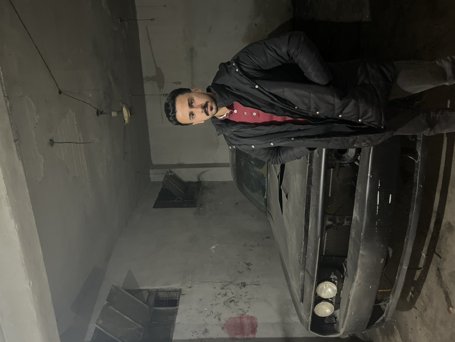 Damascus residents document motorcycle scenes, garage work during evening hours