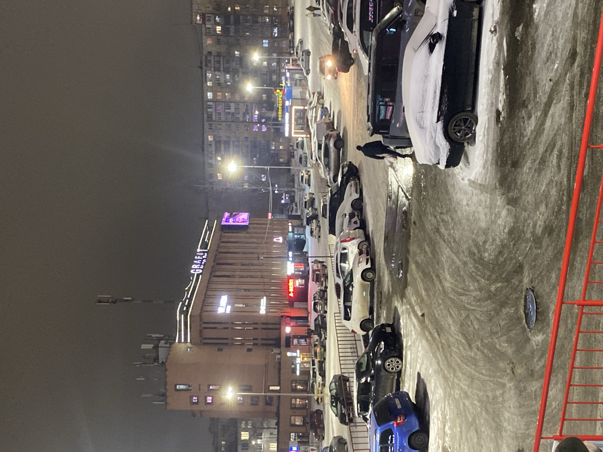 Person observed in winter evening scene in Izhevsk