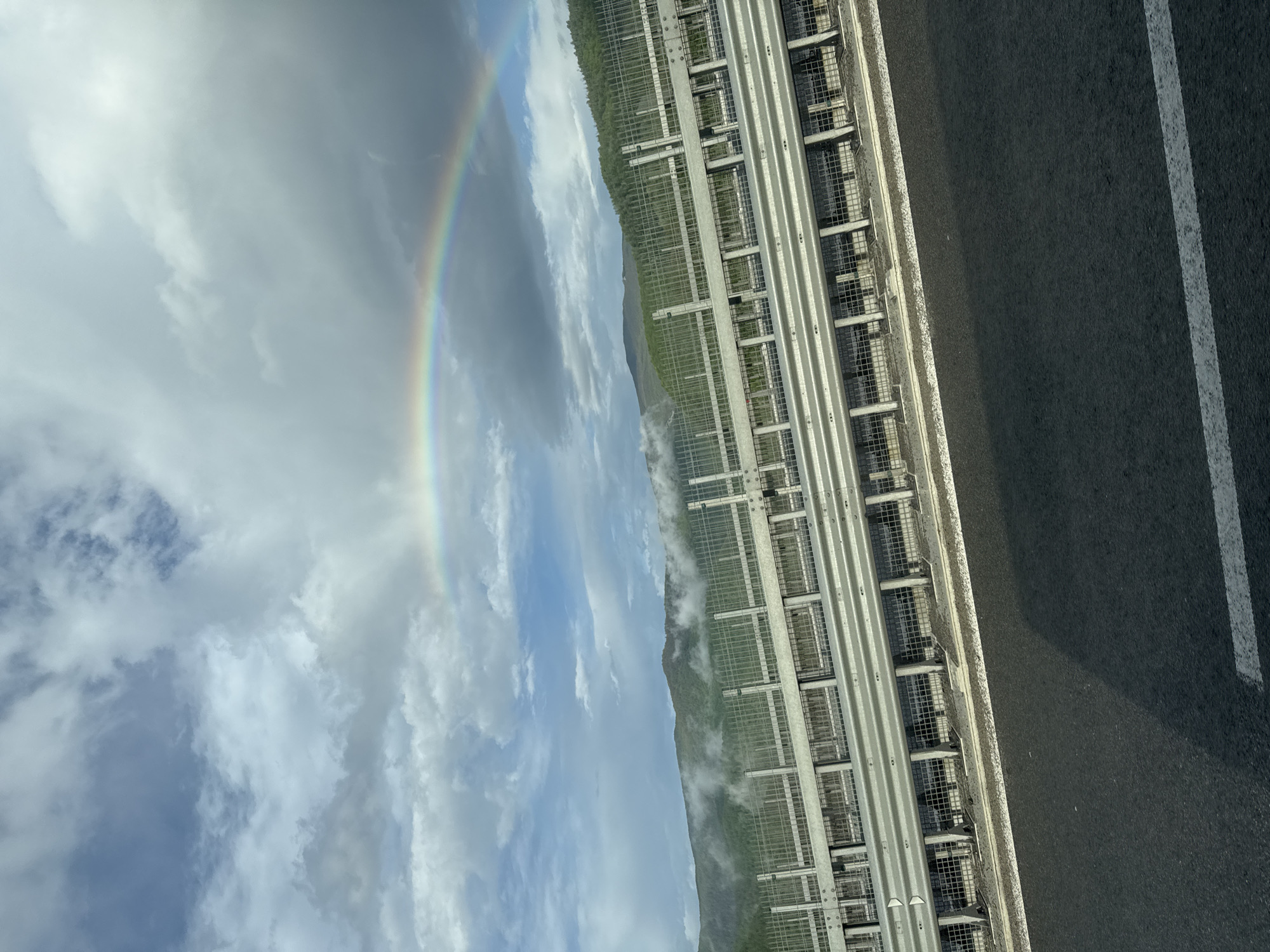 Rainbow spotted over mountain road in Vrachesh, Bulgaria