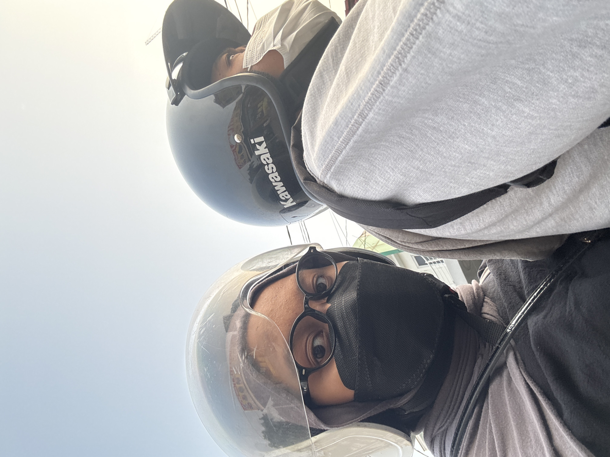 Motorcycle ride through West Jakarta alongside a propane delivery truck