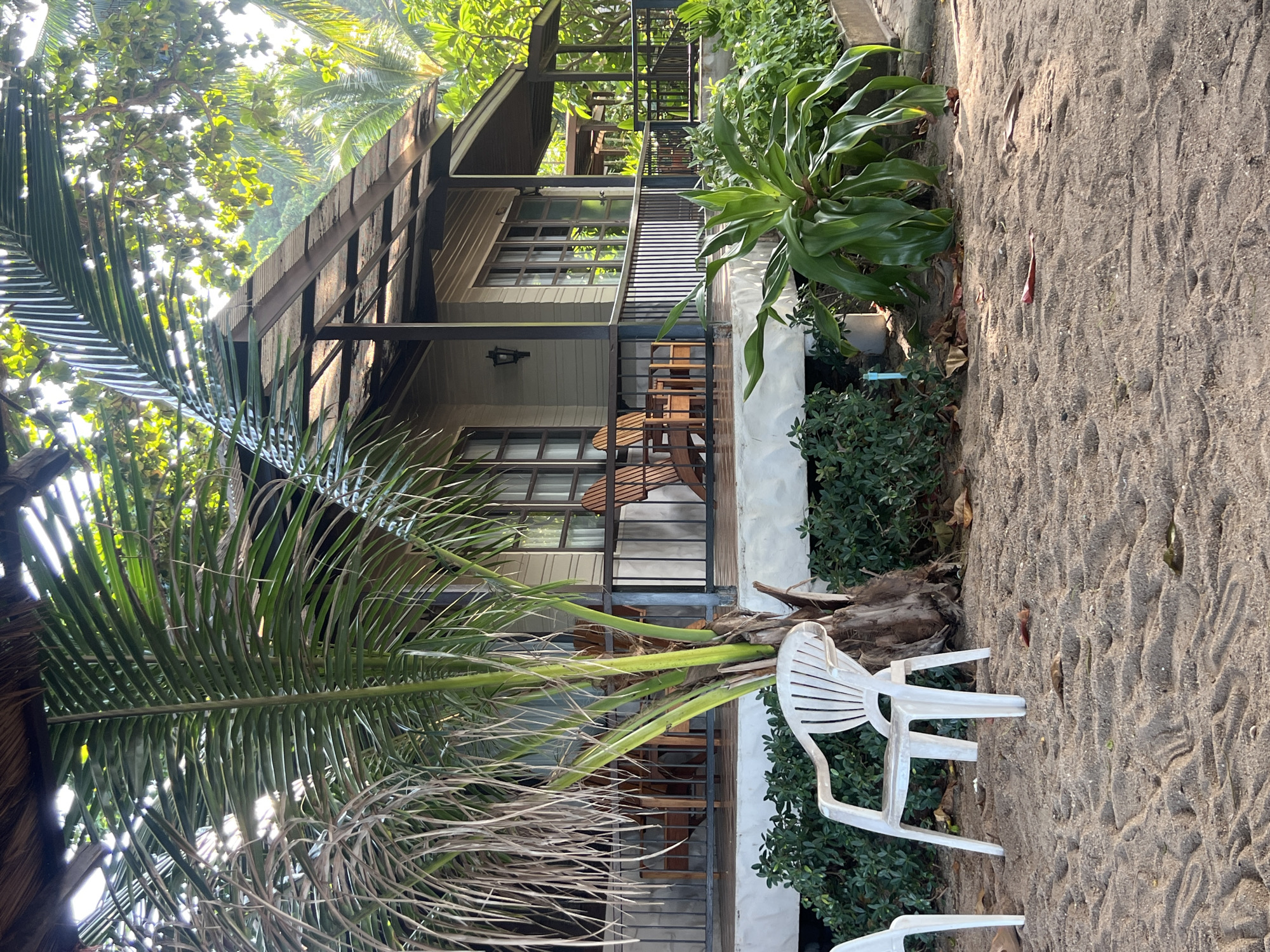 Lazy beach morning with jewelry, books, and bungalow views