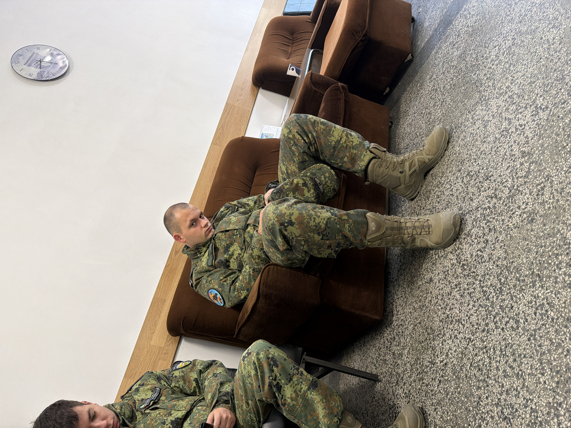 Military personnel rest indoors in Bulgarian town