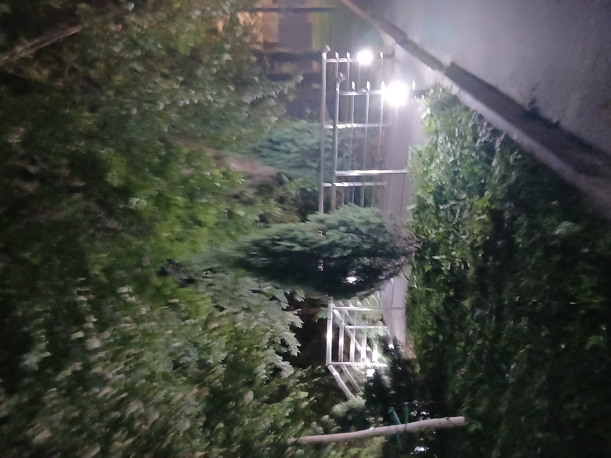 Nighttime exploration of a worn building complex in Ukrainka