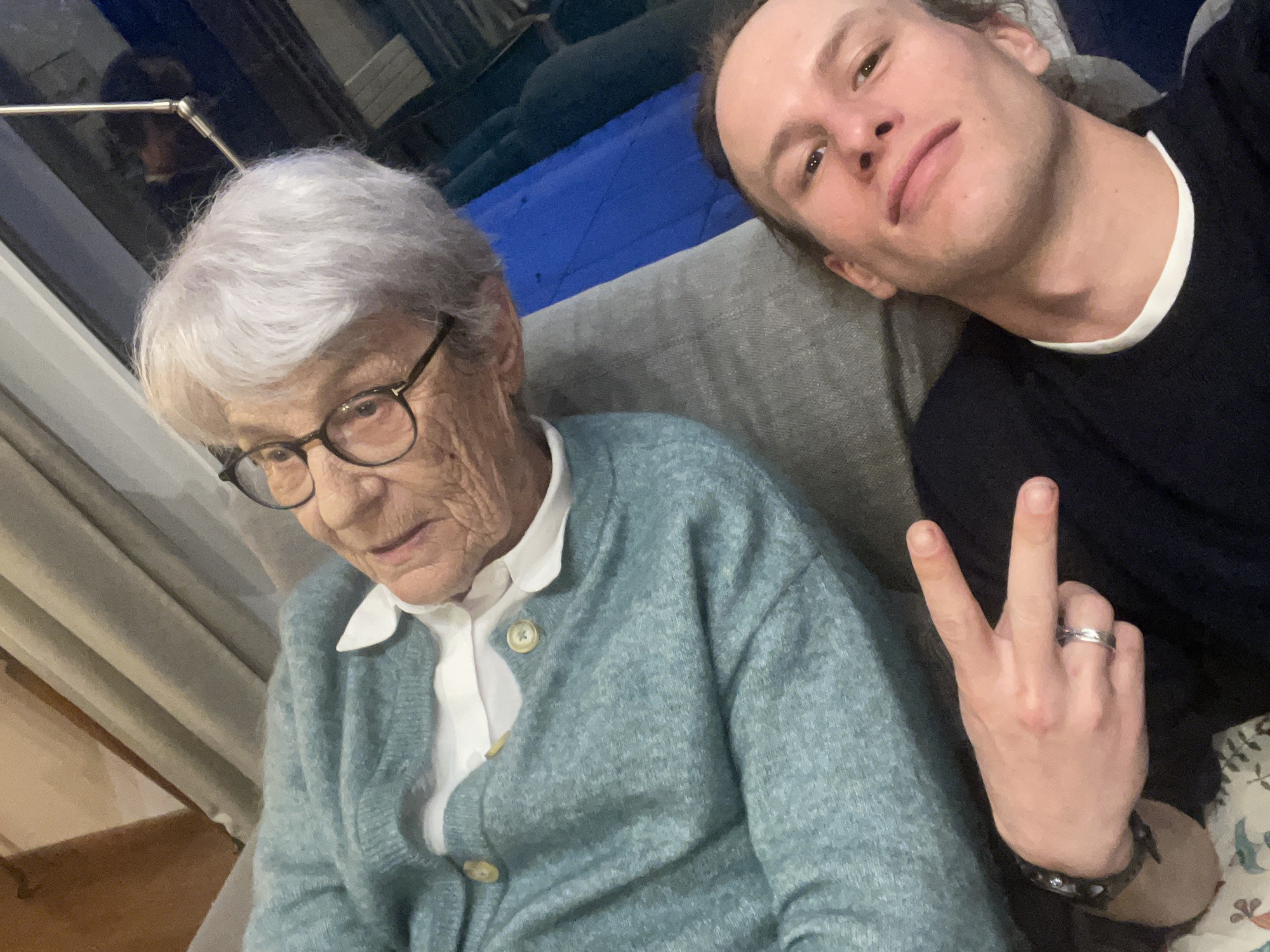 Elderly woman and young man pose together in Chambéry