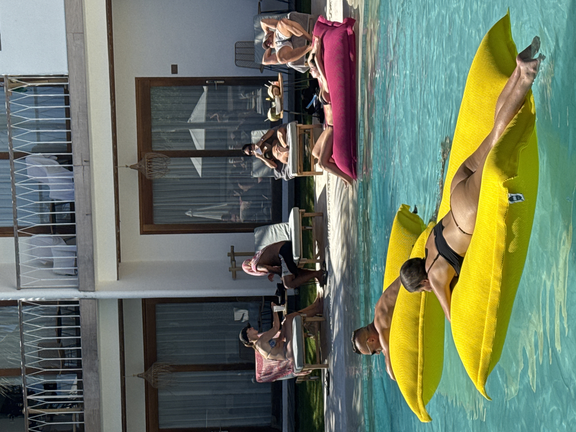 Early morning poolside relaxation documented at North Kuta resort