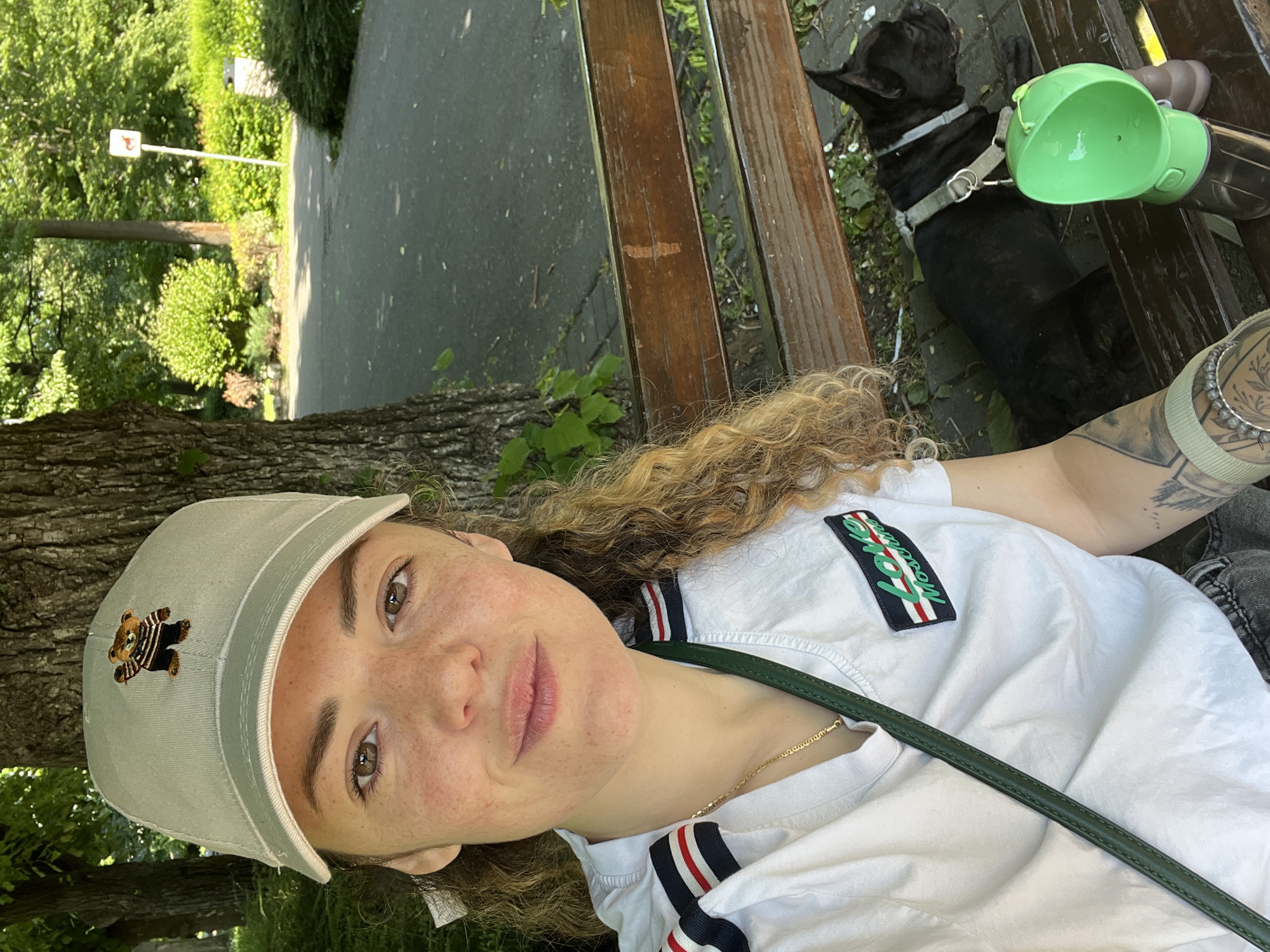 Woman with black dog enjoys morning in Burgas park