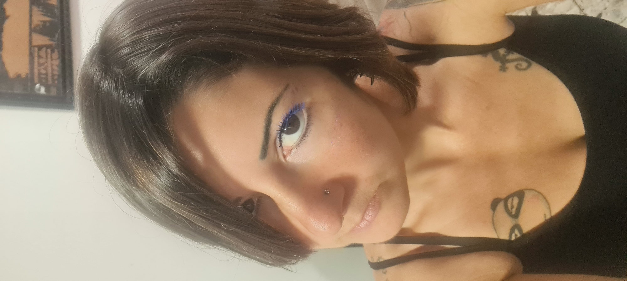 Woman applies blue mascara, takes selfies in Nahariyya home