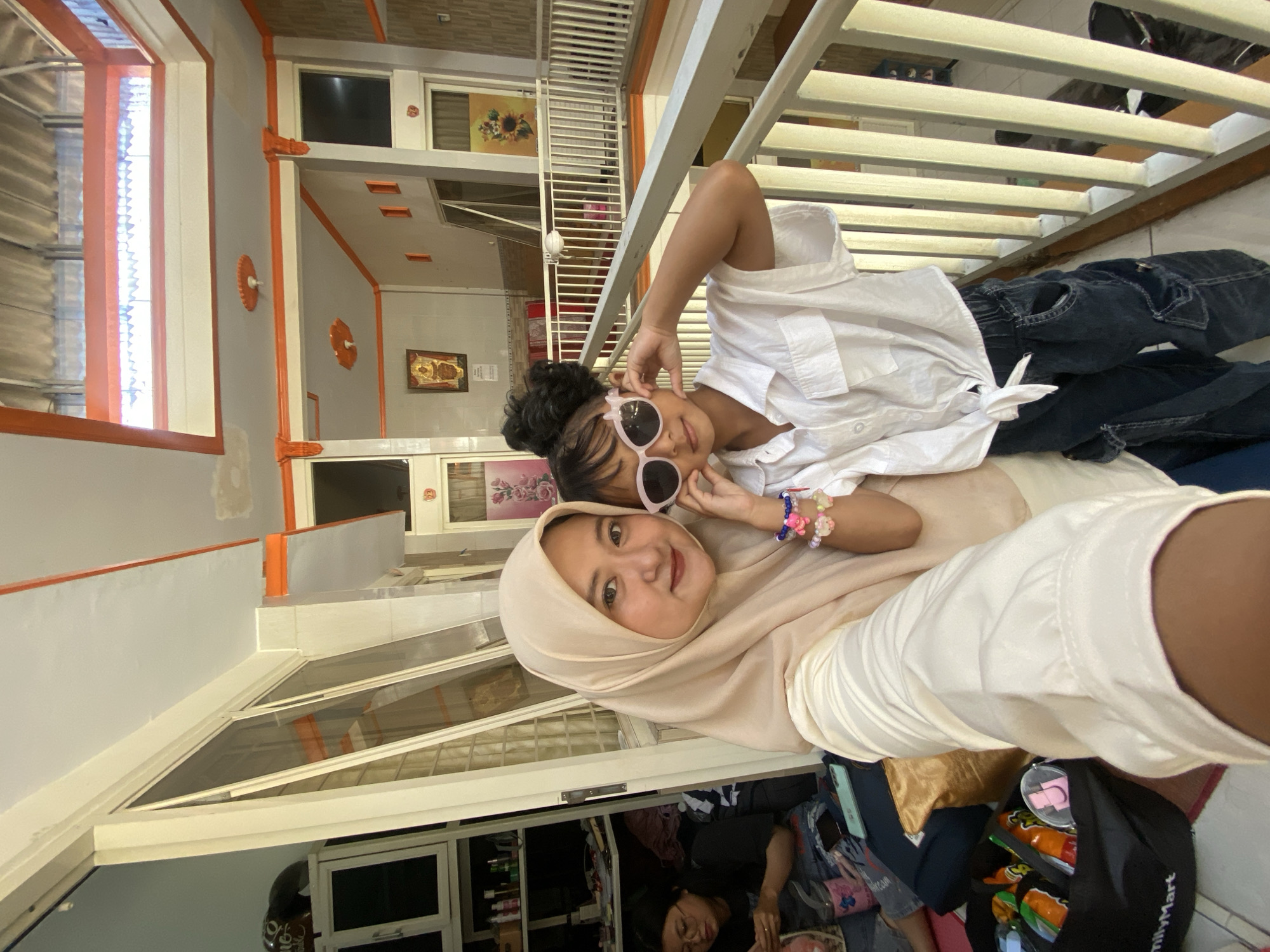 Family selfie session captured in Jember home