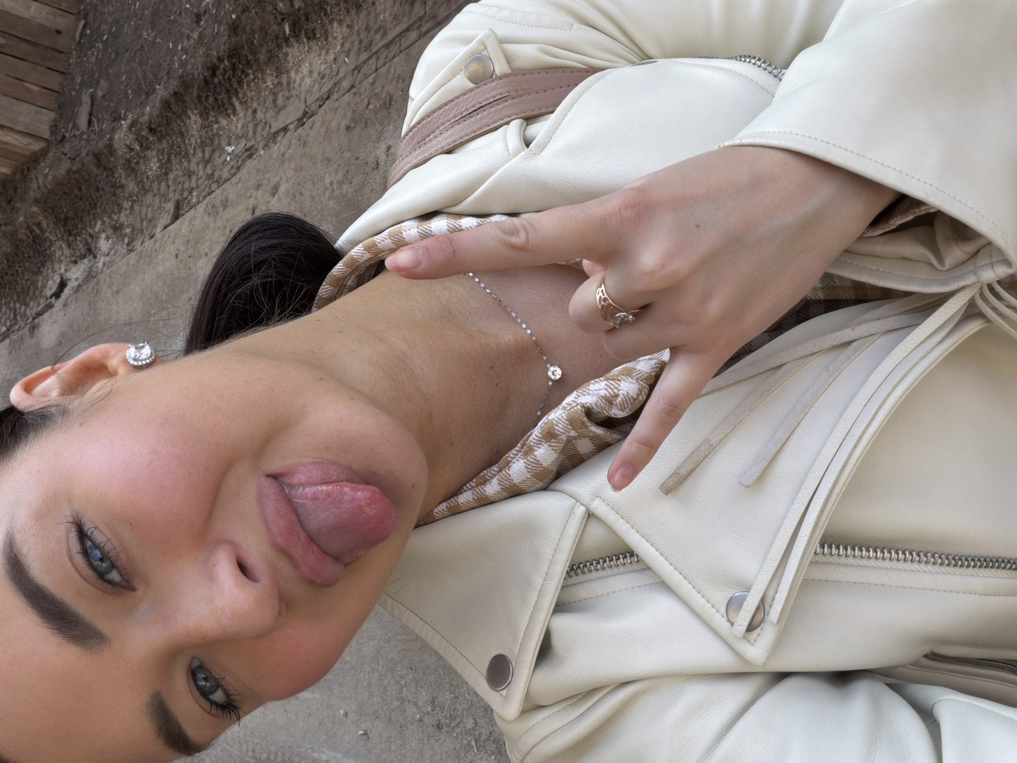 Woman makes playful gesture for camera in Moscow