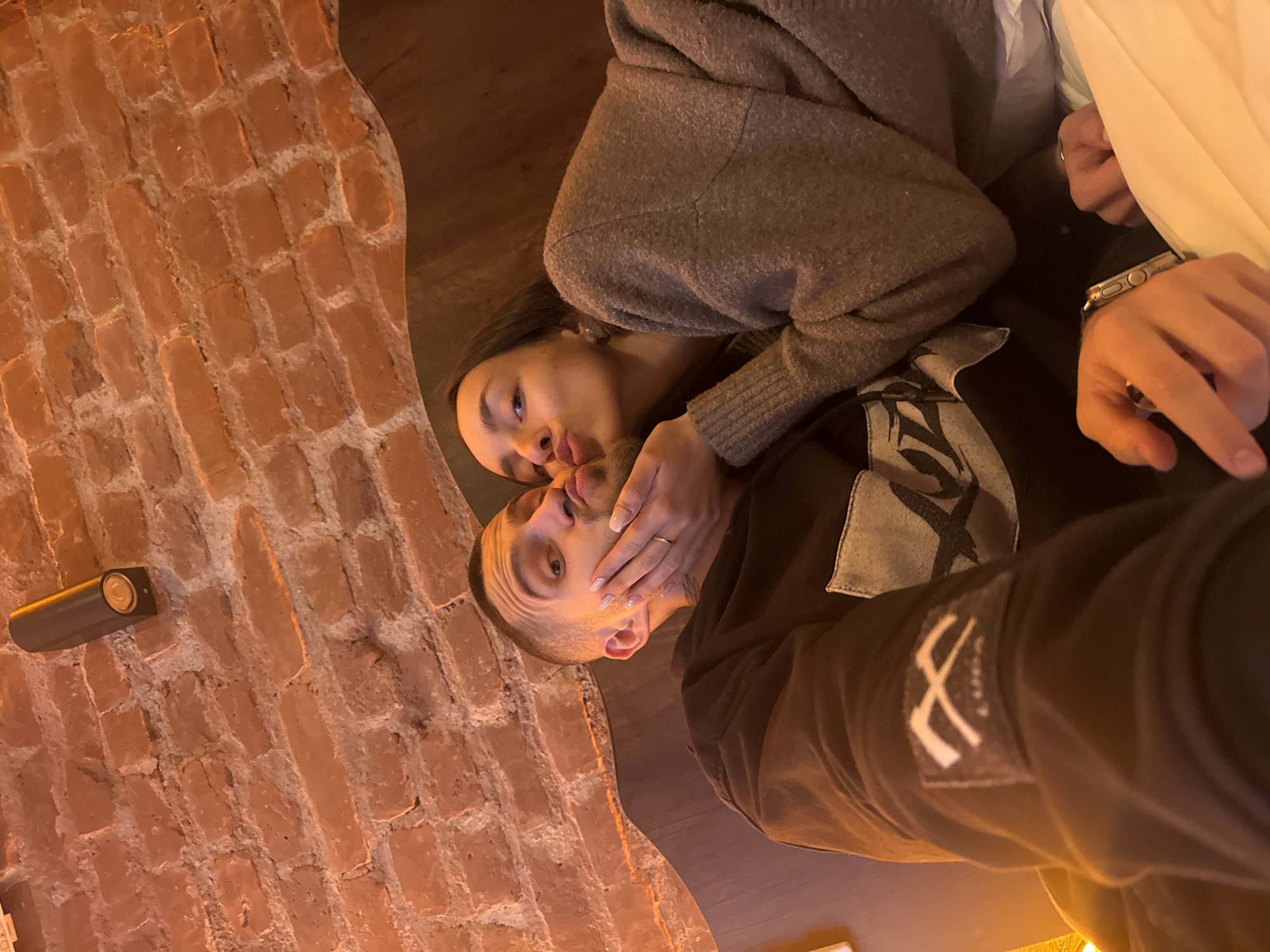 Couple photographed in intimate moment on bed in Istanbul