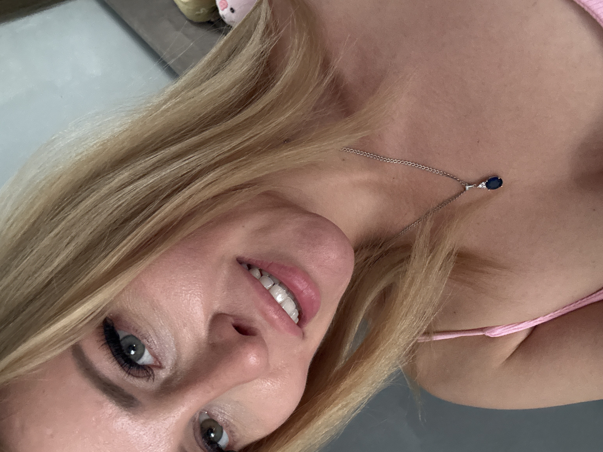 Blonde woman photographed in detailed portraits at unknown location