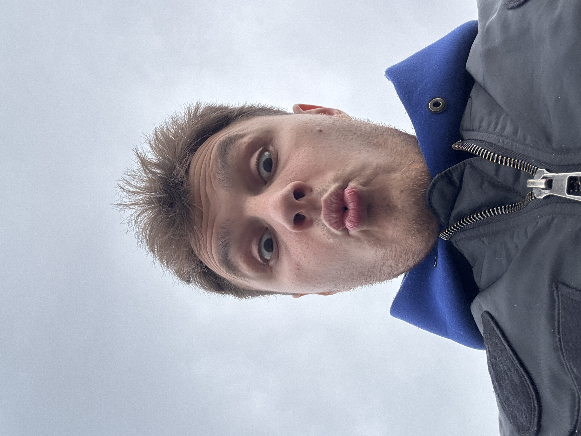 Man photographed looking down at camera in Plovdiv