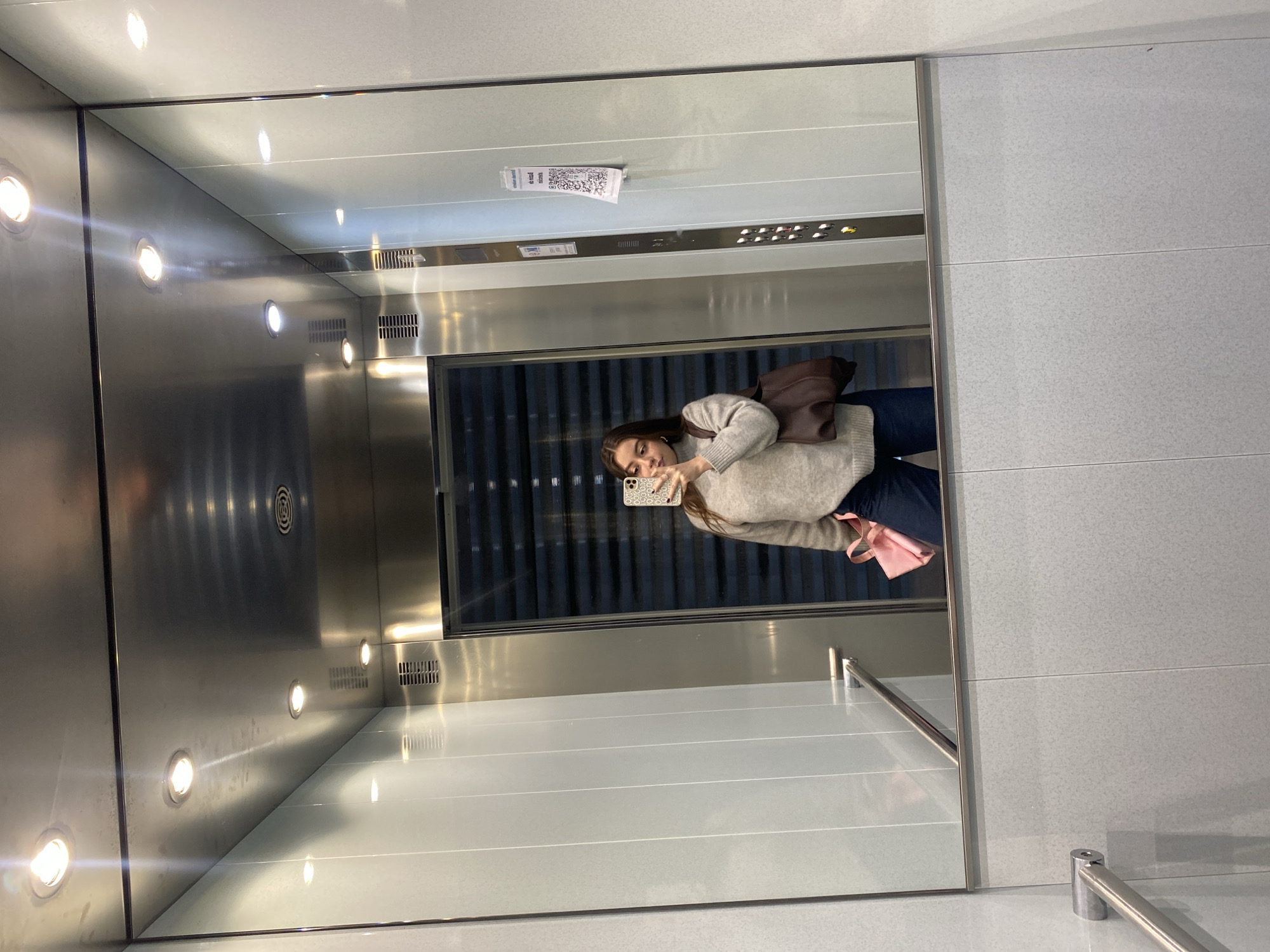 Woman takes elevator selfie in early morning hours