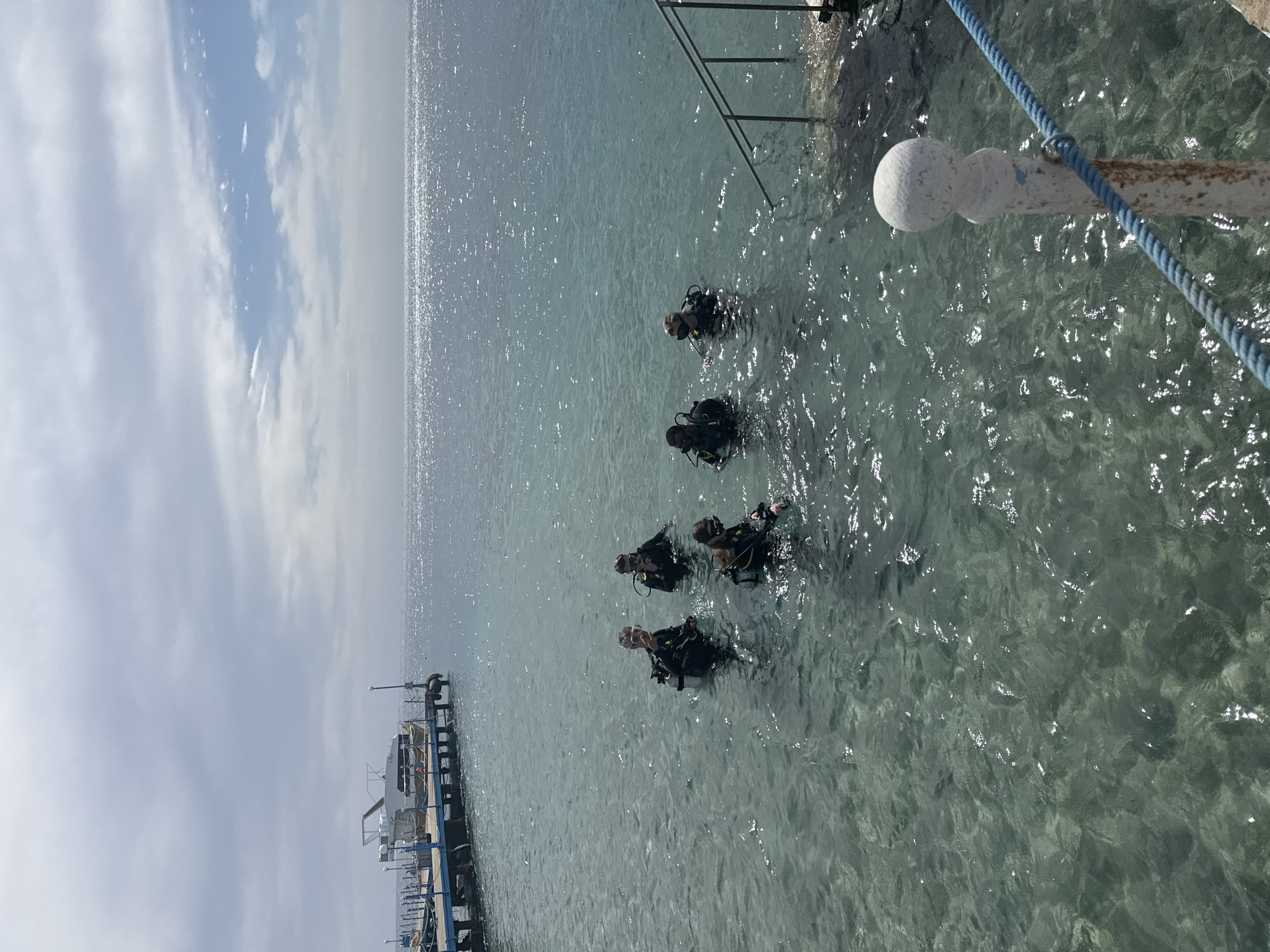 Divers prepare for underwater excursion near Safaga pier