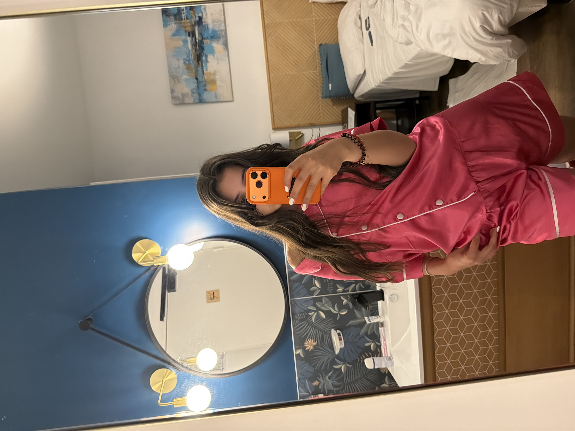 Woman takes mirror selfies in Cannes hotel room