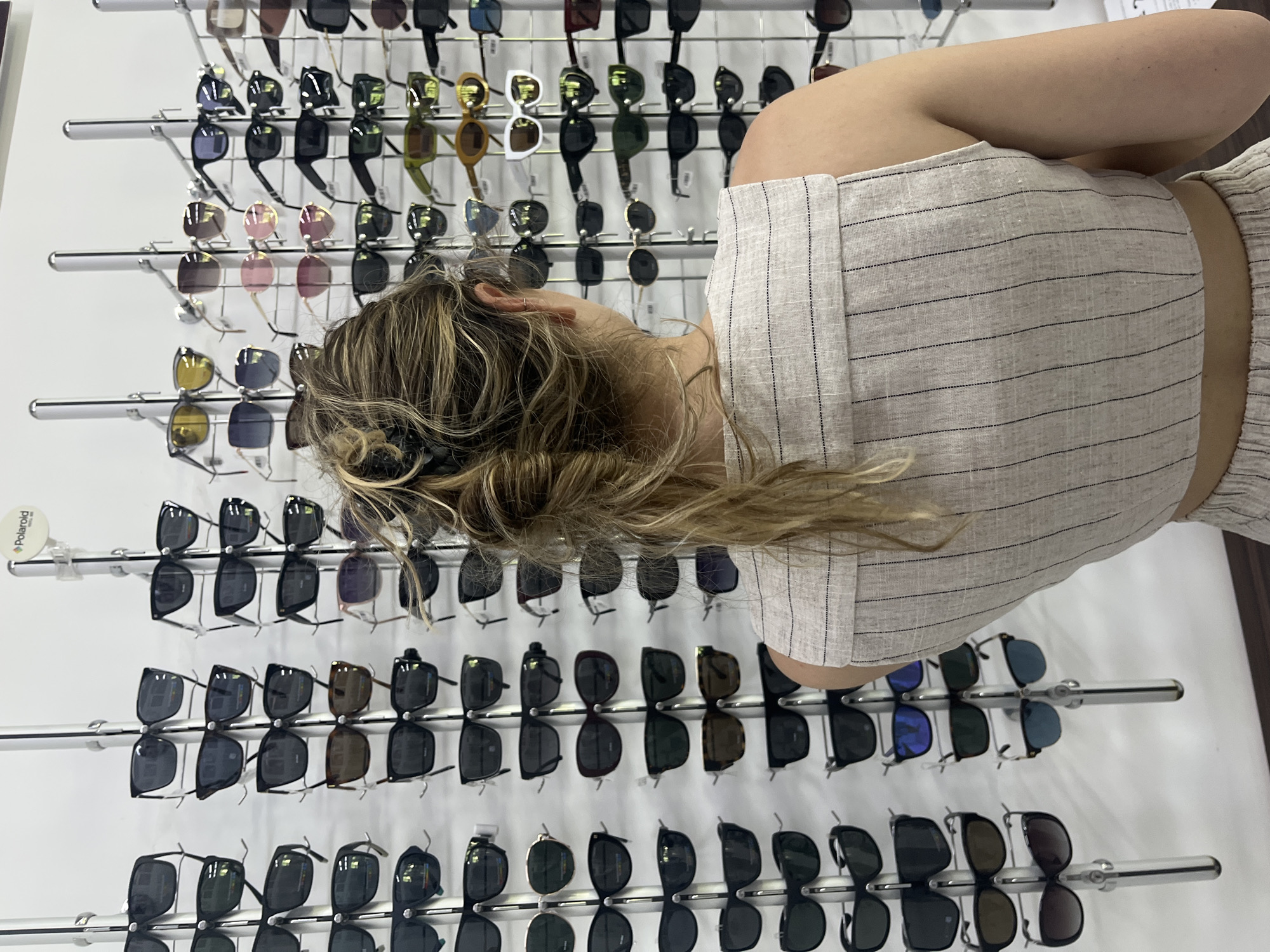 Shopper browses clothing and accessories in Blagoevgrad retail store