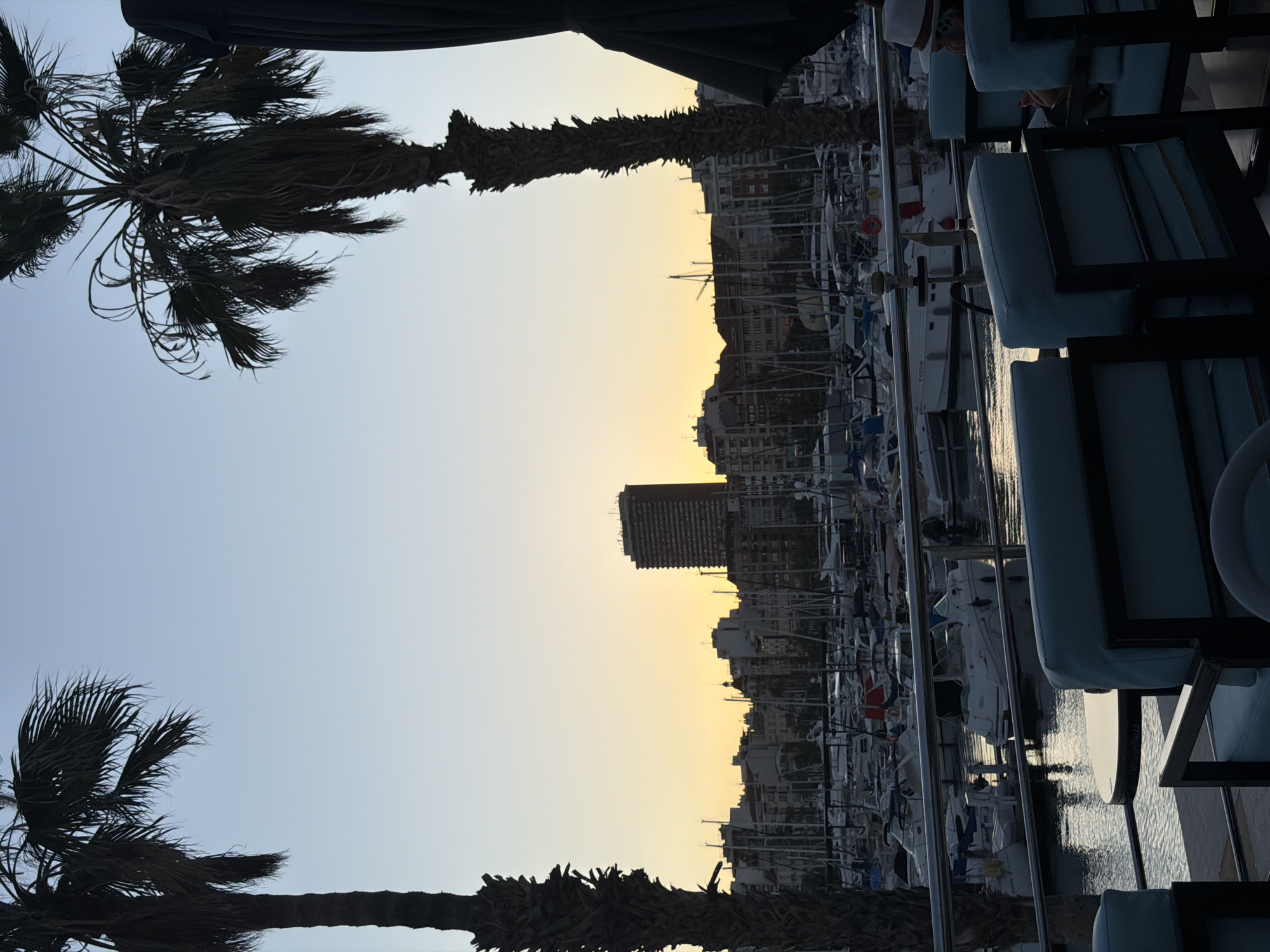 Evening cocktails at marina-view restaurant in Alicante, Spain