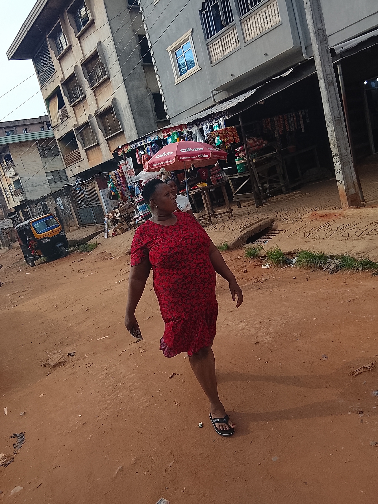 Daily life captured on Onitsha streets during overcast afternoon