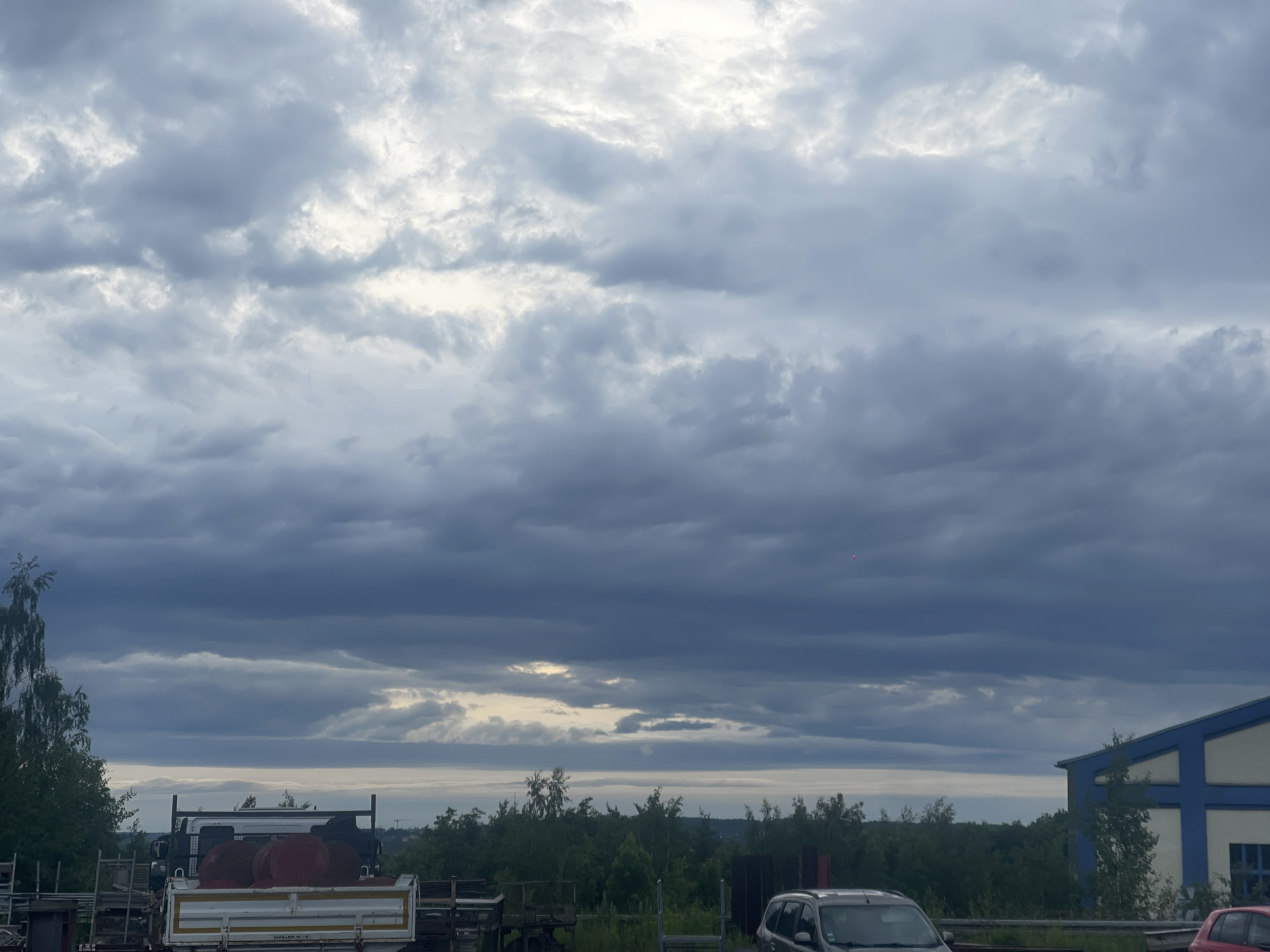 Overcast afternoon documented at industrial facility June 4th