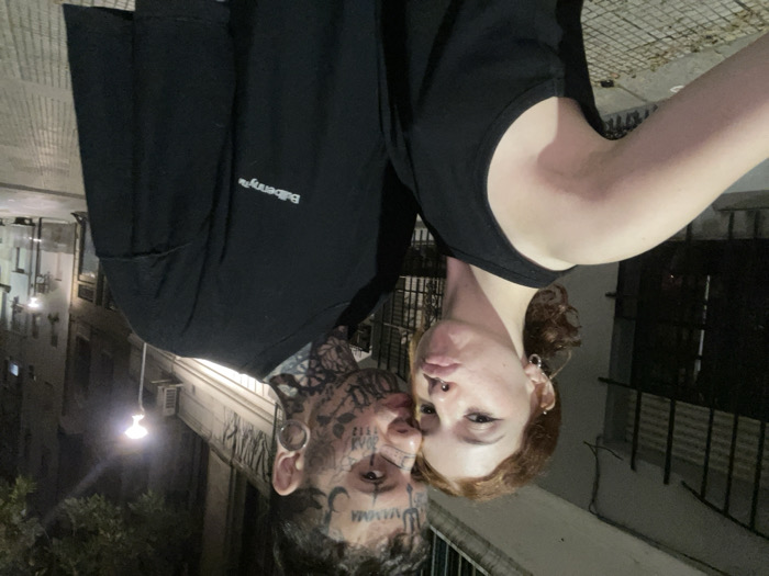 Late-night street scene captured in Buenos Aires with dancers, dog