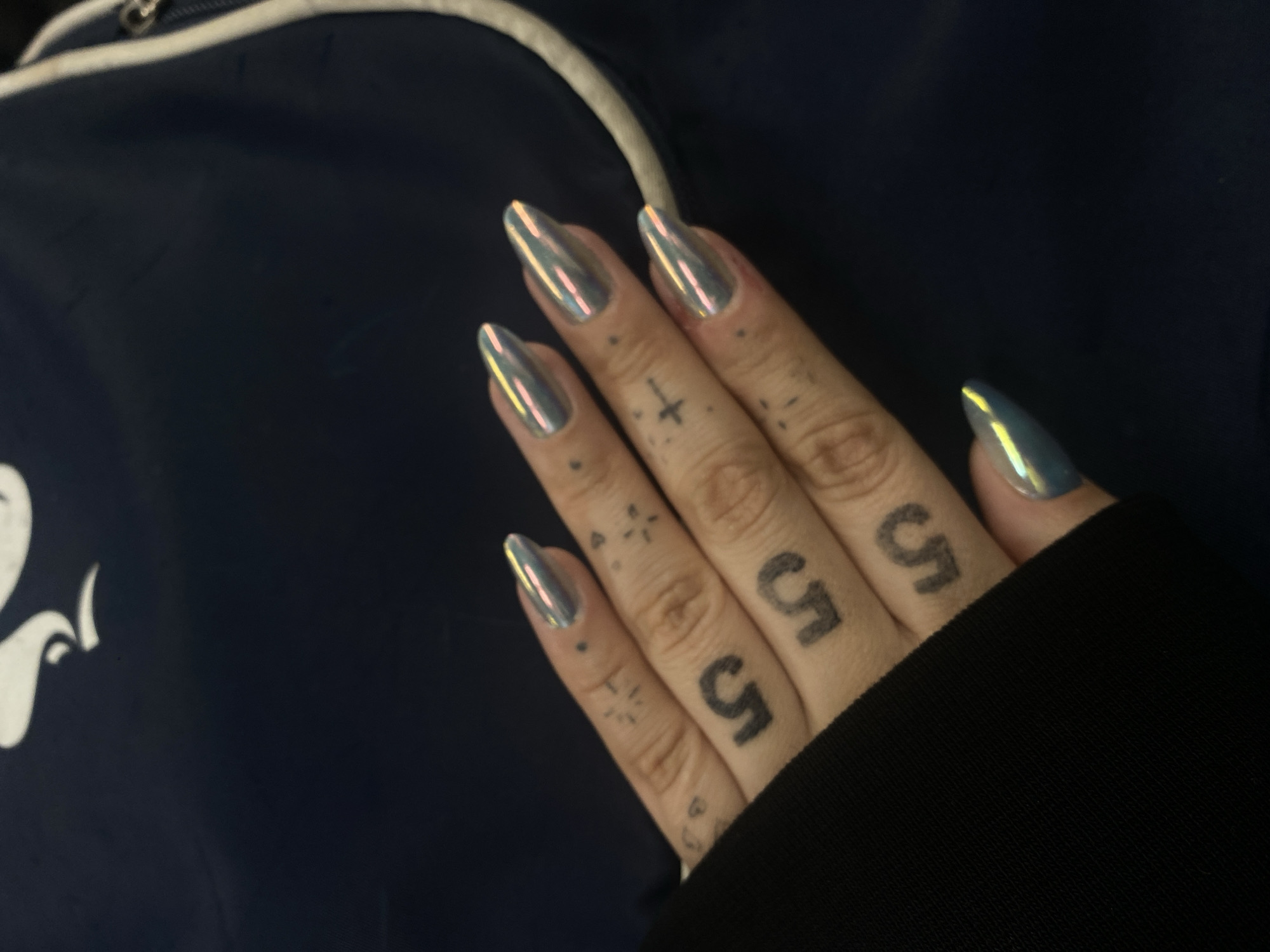 Tattooed individual with metallic nails documented across Buenos Aires