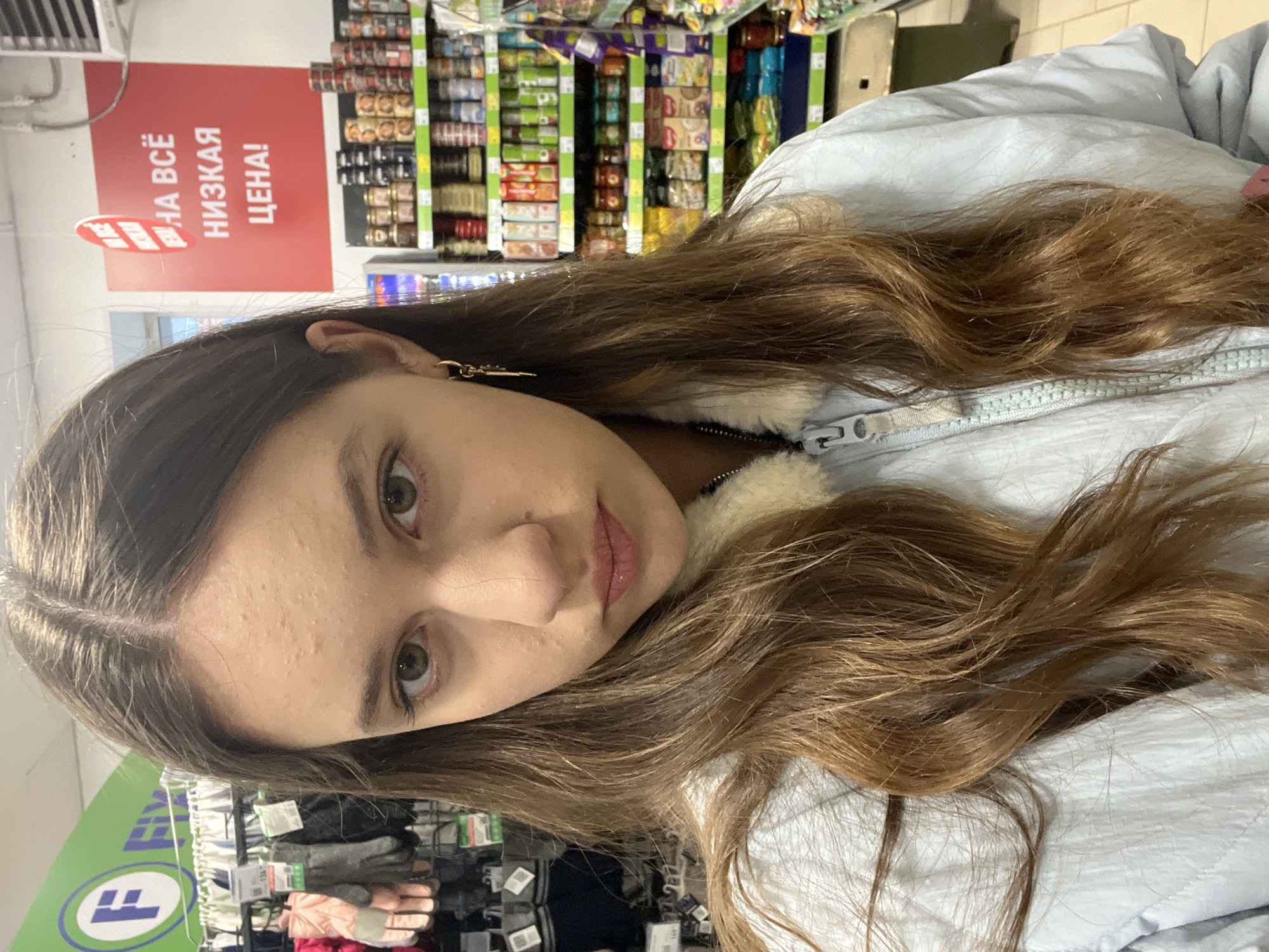 Woman shops at store in Novo-Nikol'skoe, Russia