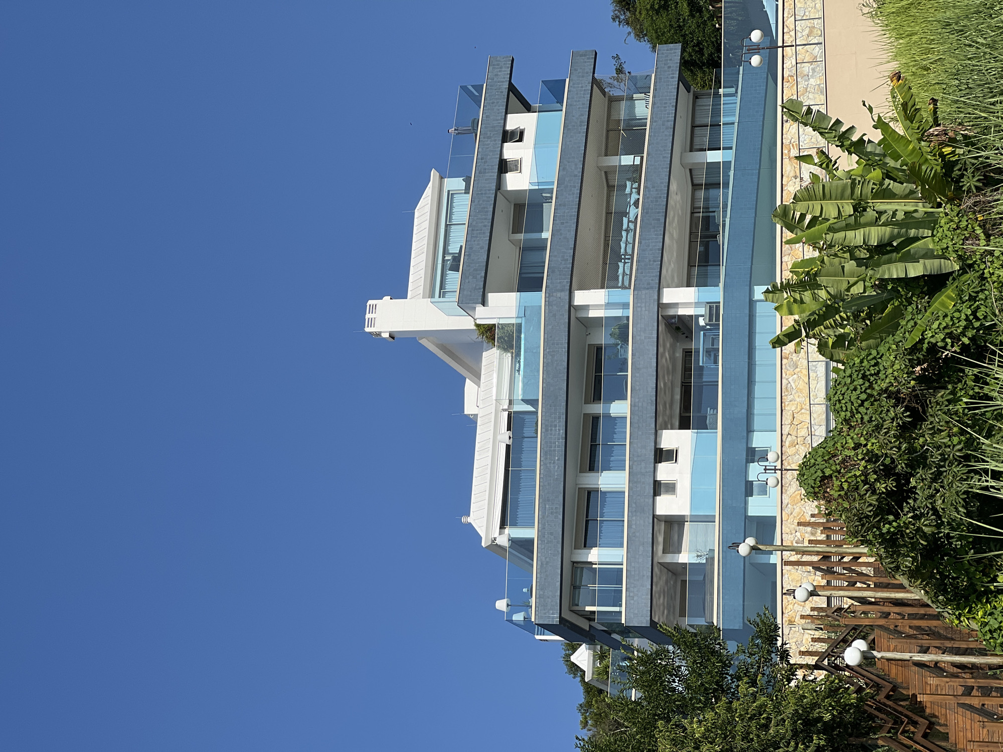 Evening scenes captured in Florianópolis show urban architecture, busy beaches