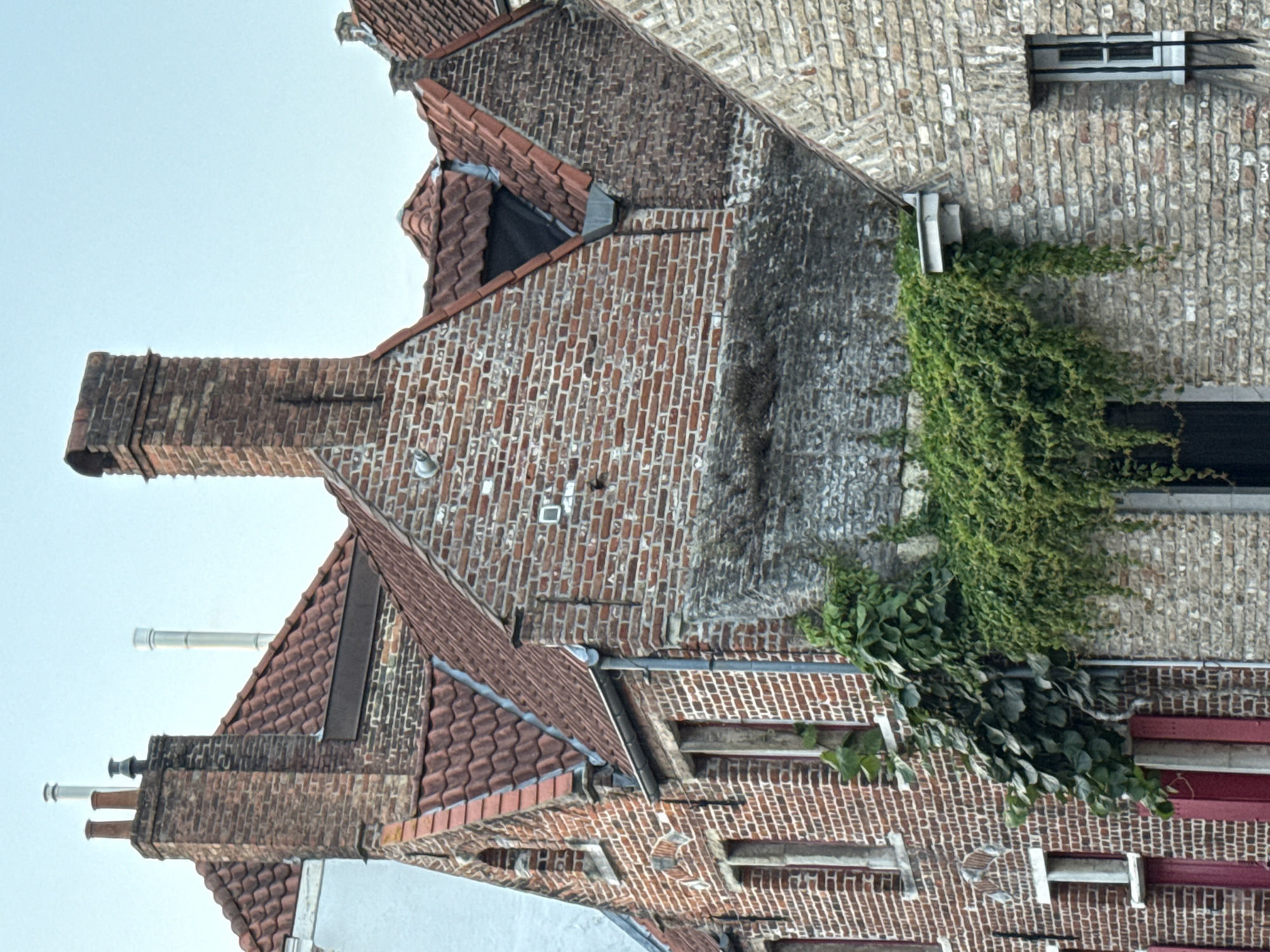 Full moon rising over Bruges canals and Gothic architecture