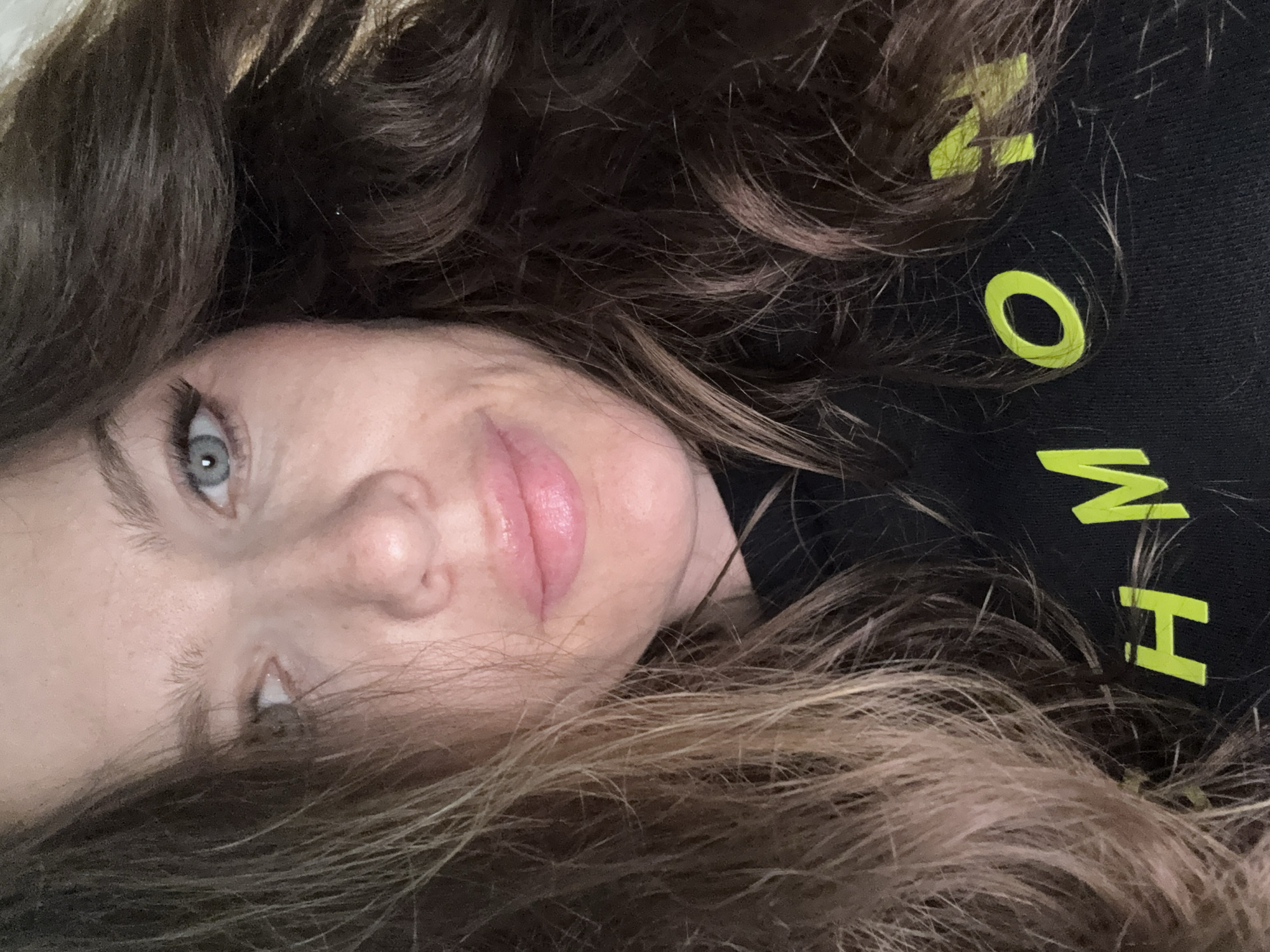 Woman takes selfie in Moscow wearing lettered shirt