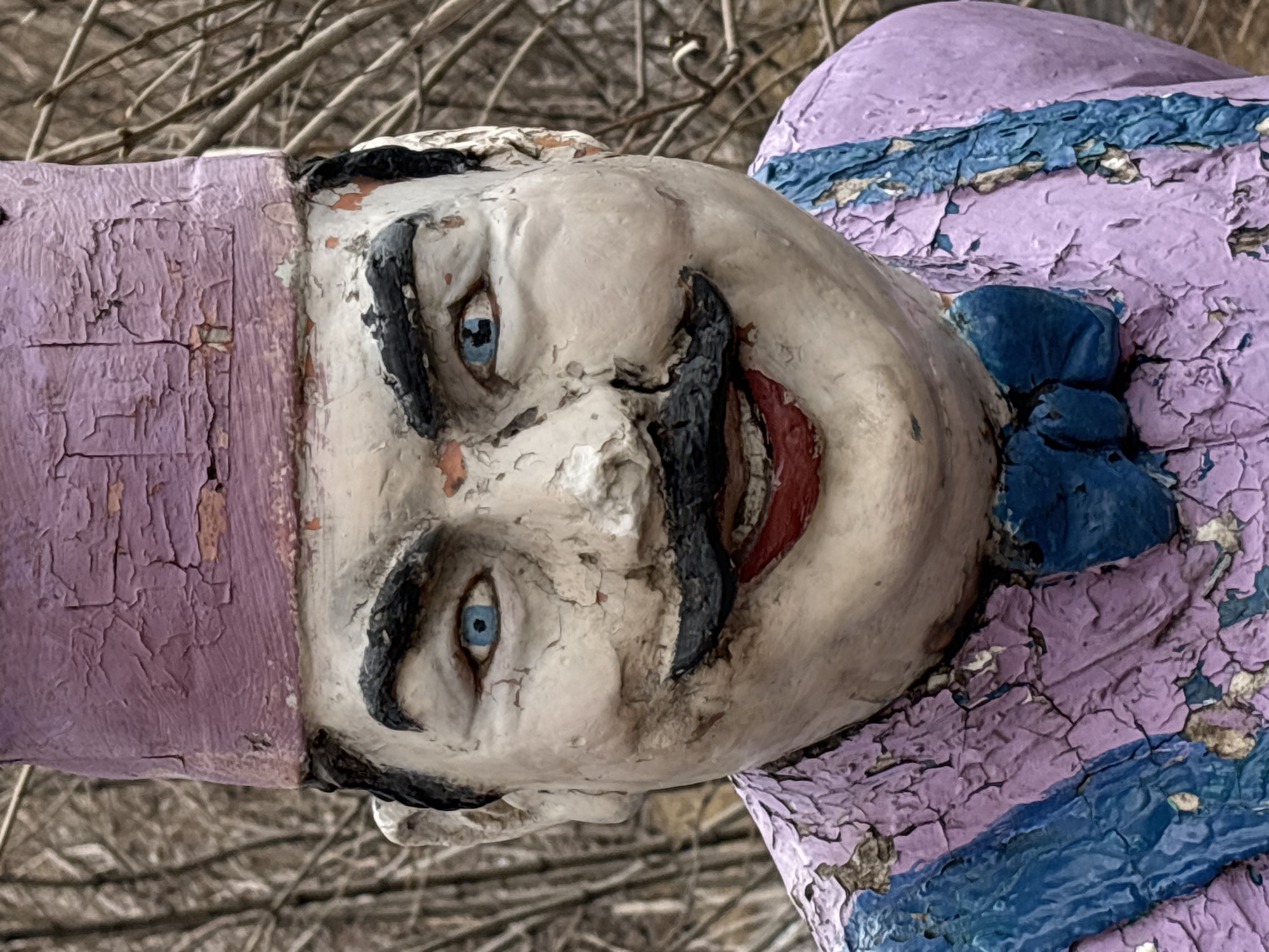 Weathered chef statue documented by witnesses in park setting