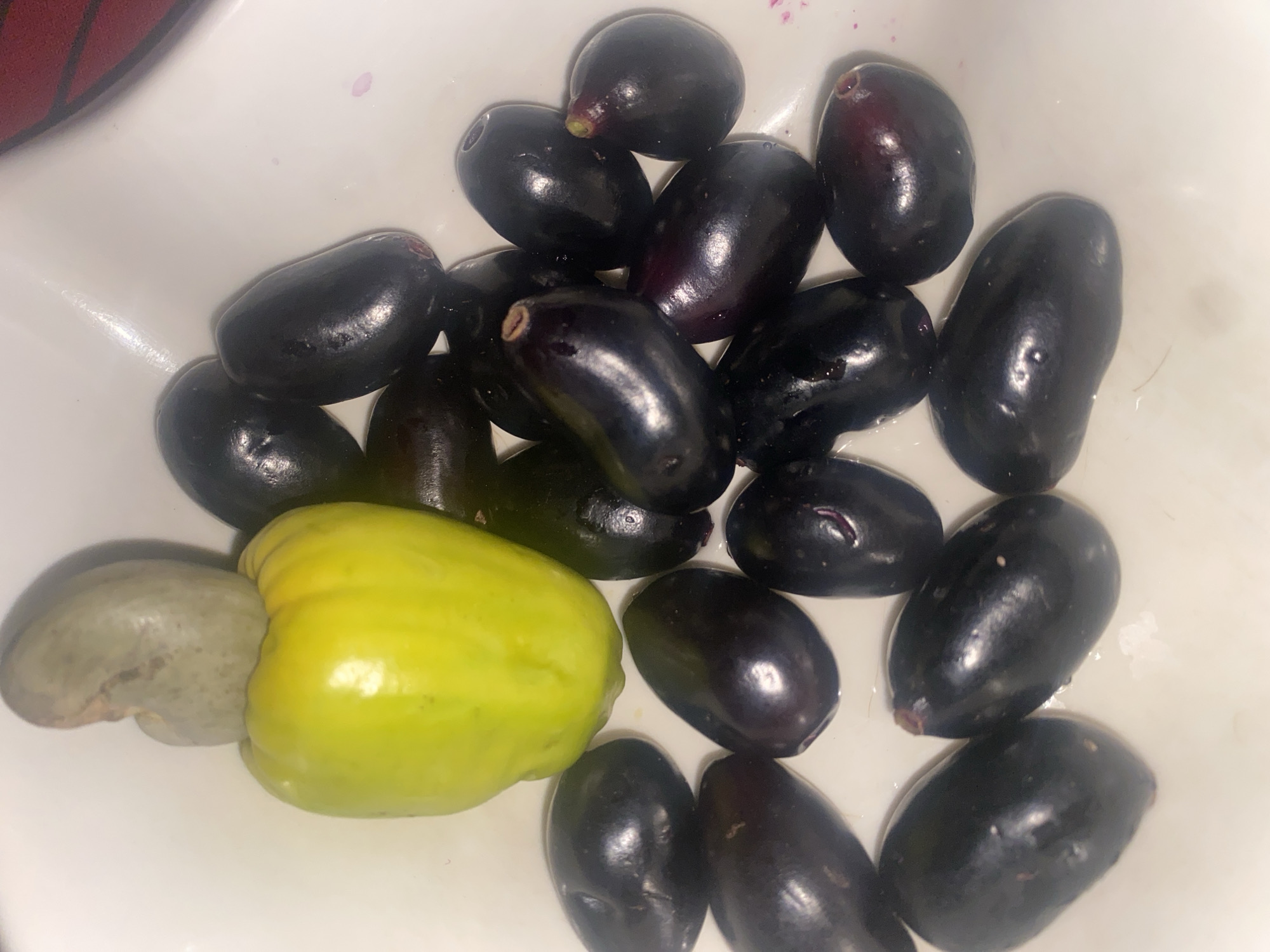 Java plums and cashew fruit displayed in Rido, Nigeria