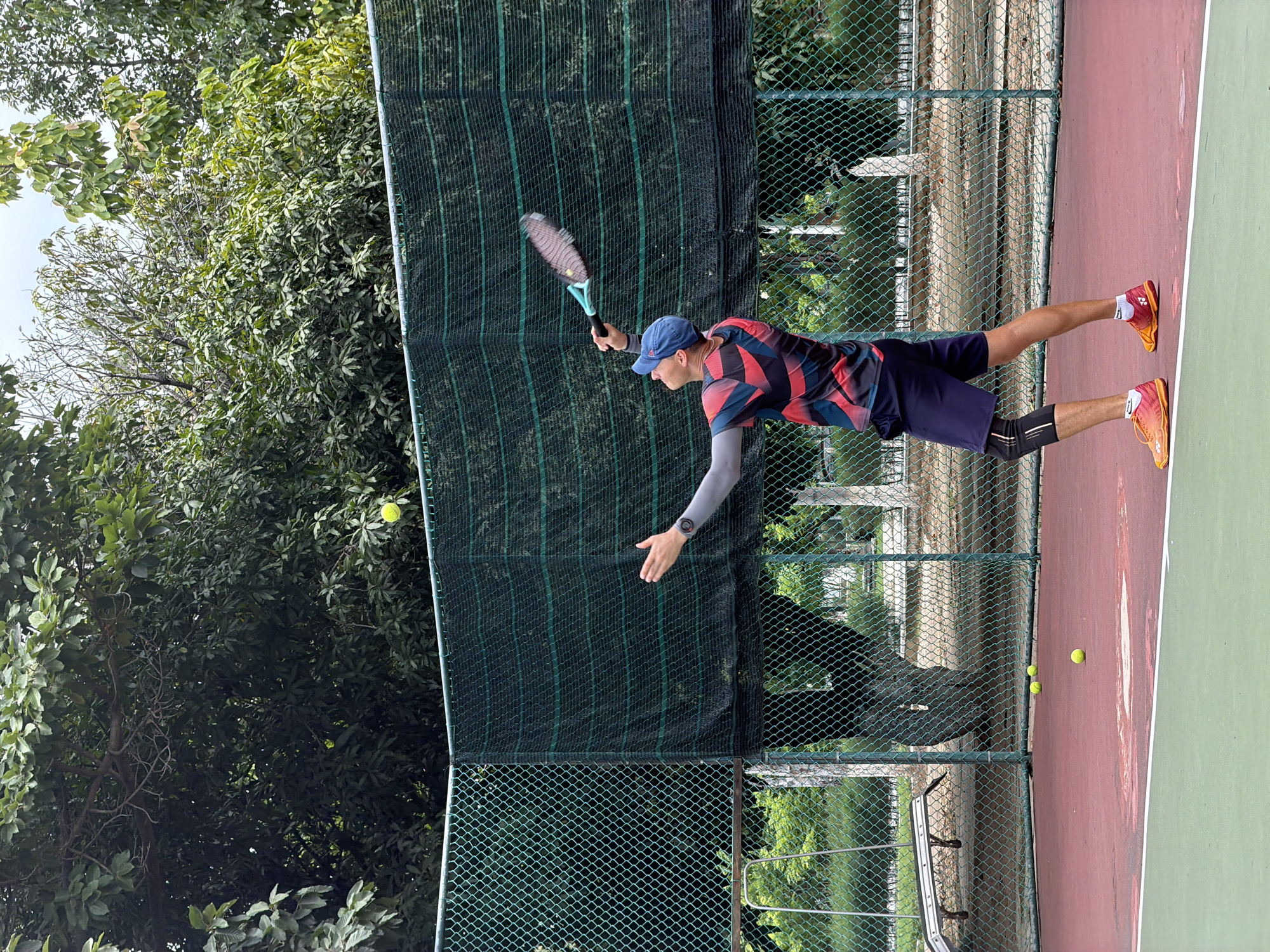 Tennis player observed in action at Nha Trang court