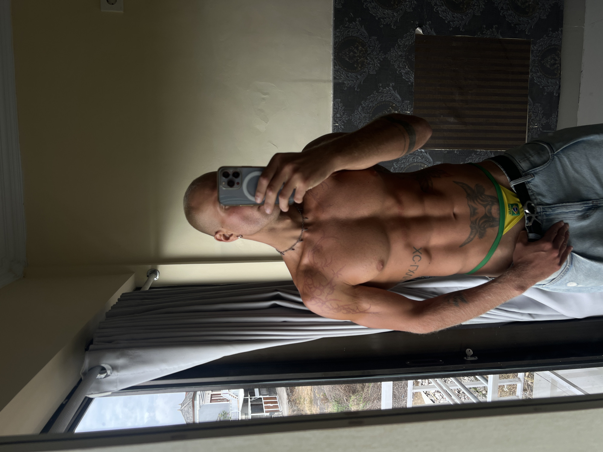 Hotel room mirror shots in North Kuta, Brazil gear and tattoos