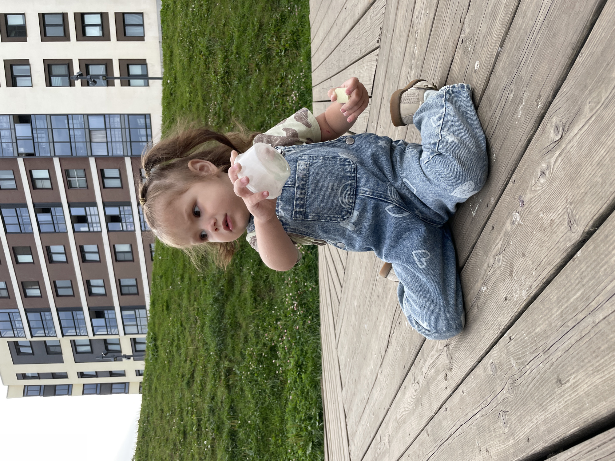 Relaxing on a wooden deck in a residential Izhevsk neighborhood