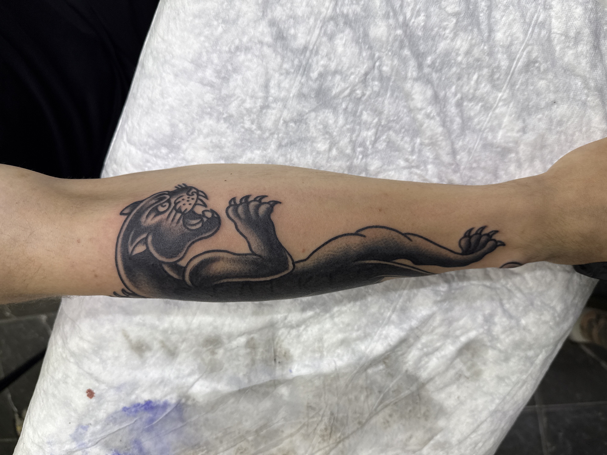 Black panther and gauntlet tattoos inked in Moscow