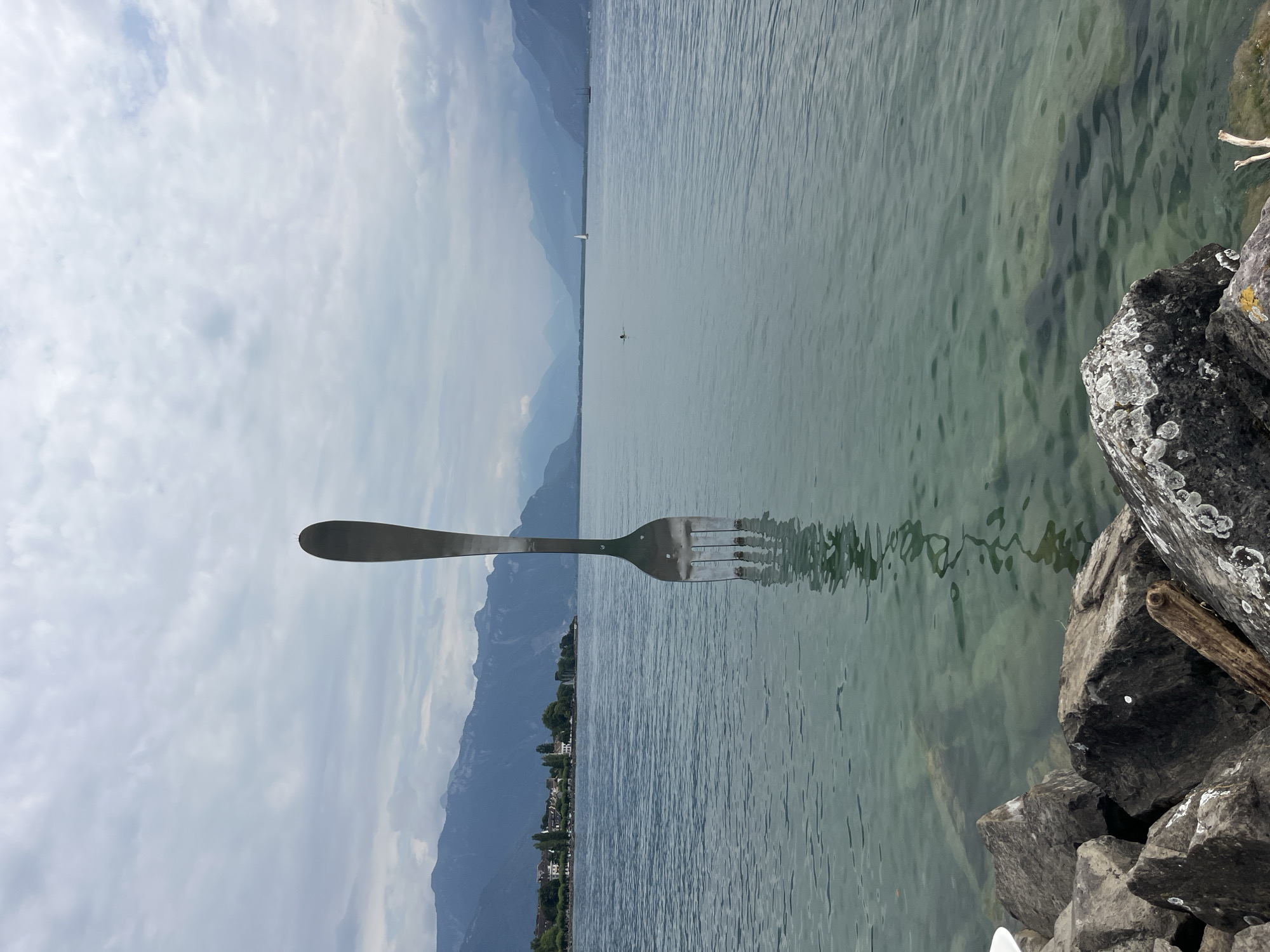 Oversized fork sculpture stands in Lake Geneva, Vevey