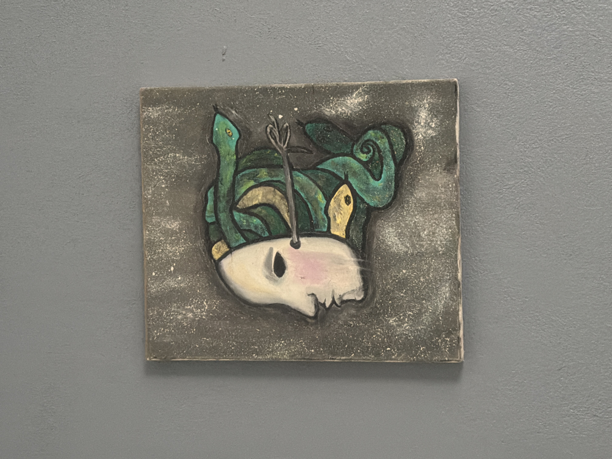 Art displays observed in Cuautla featuring abstract and skull paintings