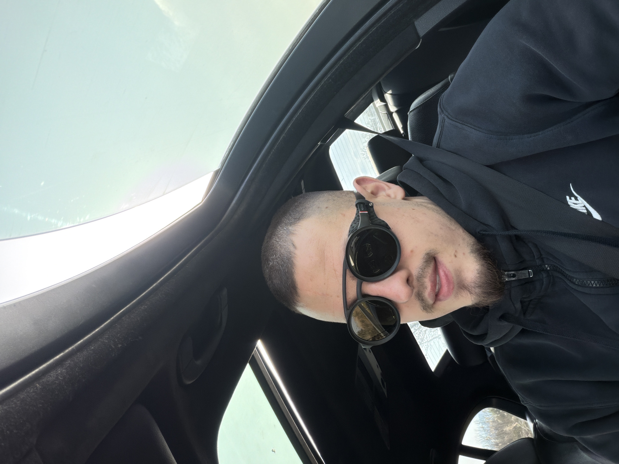 Man in Nike hoodie photographed in car near Plovdiv