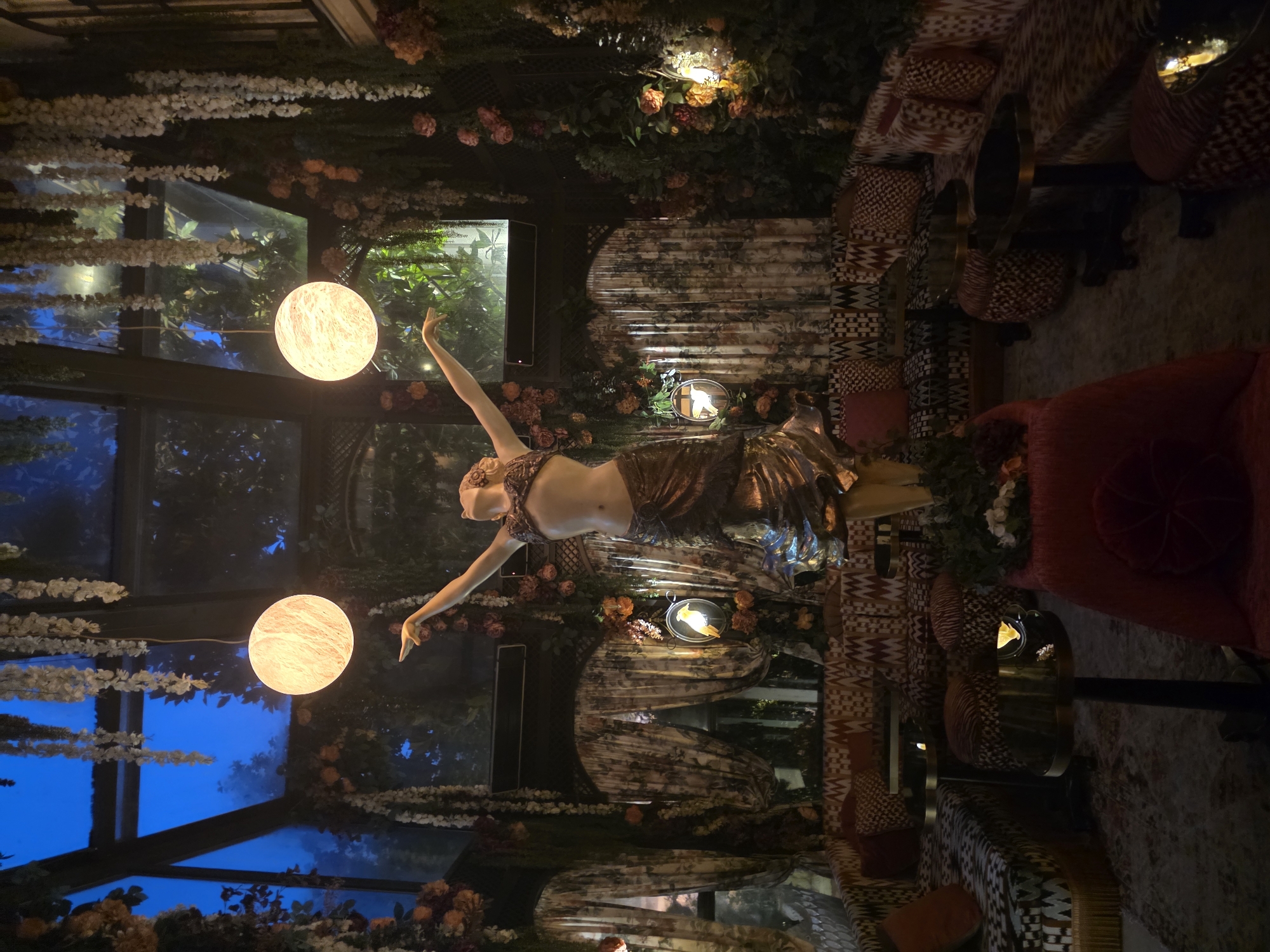 Inside an ornate, dimly lit Parisian lounge