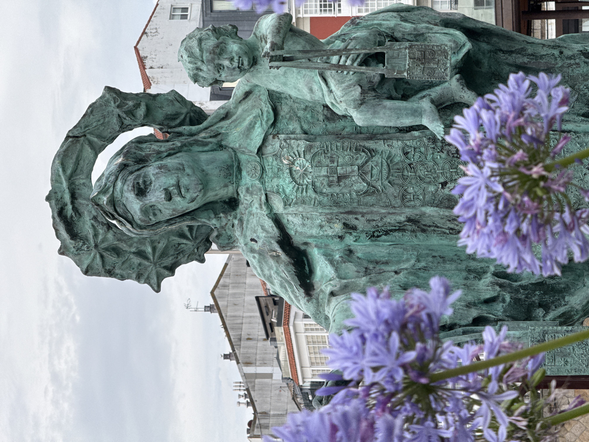 Weathered Virgin Mary bronze statue in A Coruña park