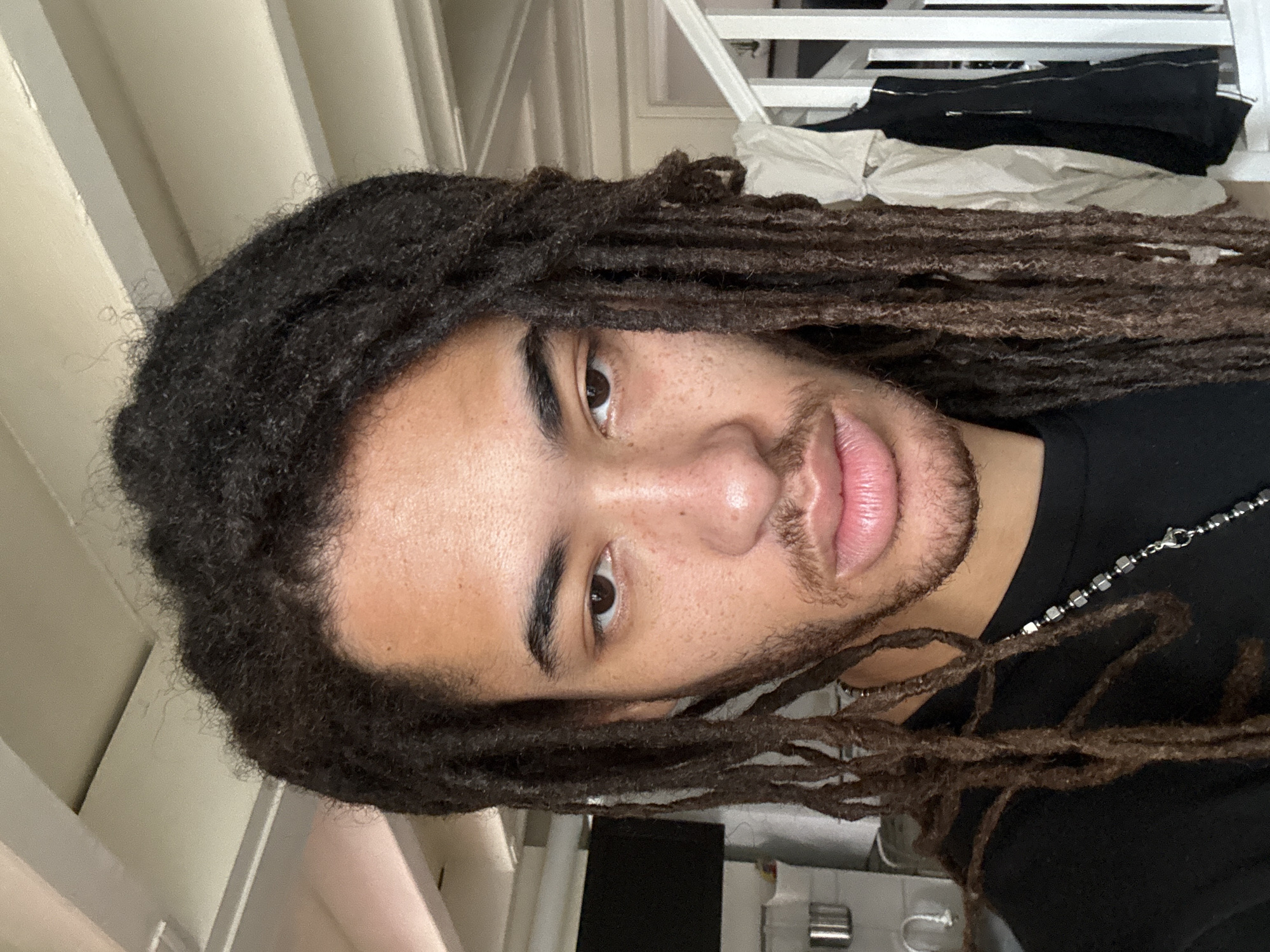 Man with dreadlocks photographed indoors in Paris apartment