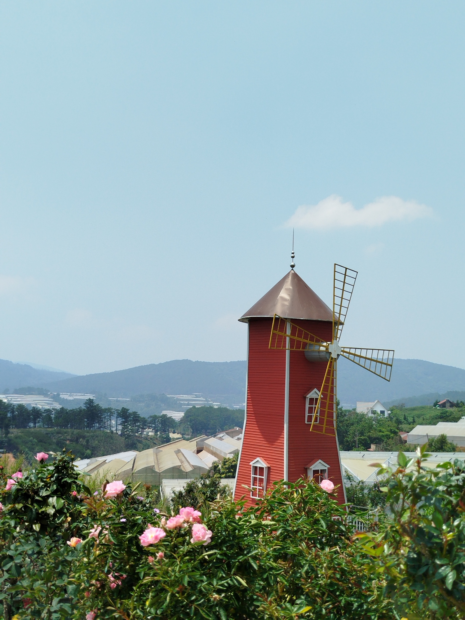 European-style windmill and buildings captured in Đà Lạt gardens