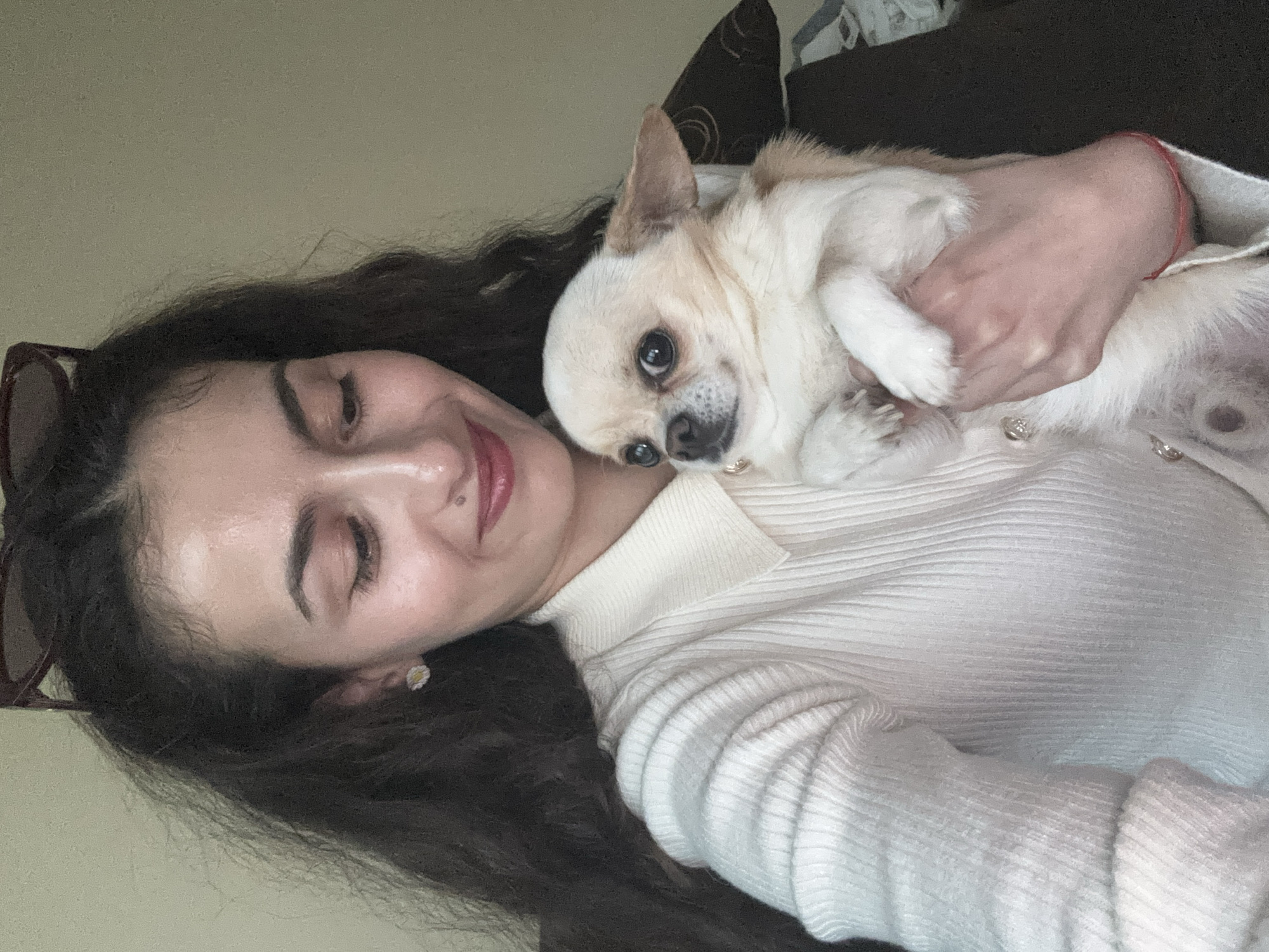 Woman holds chihuahua in Sofia, Bulgaria