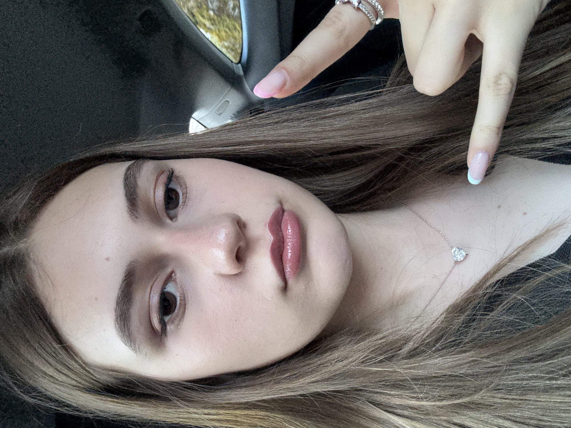 Woman takes playful car selfies in Baden-Baden