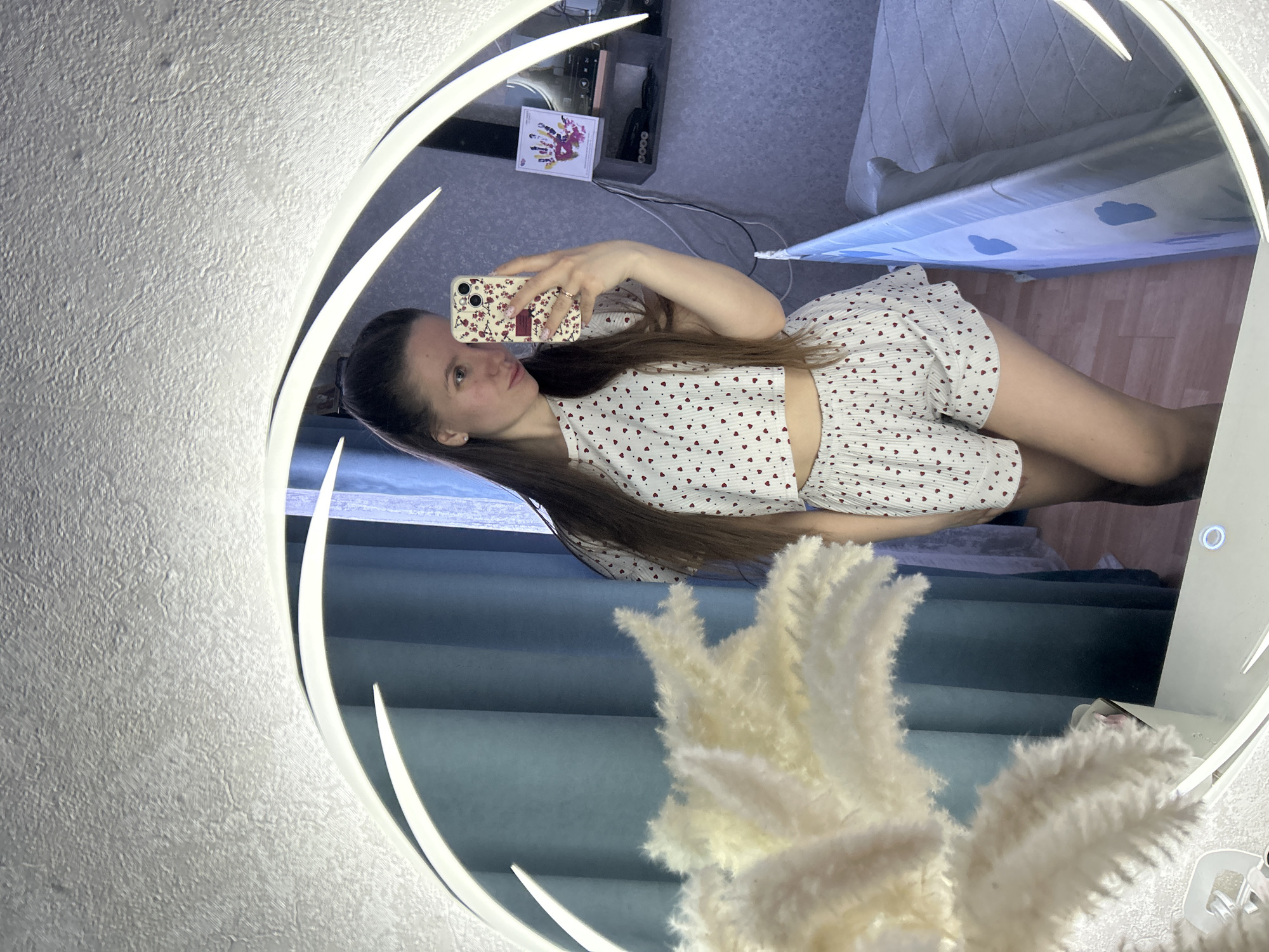 Woman takes selfie, rests in bedroom in Klin, Russia