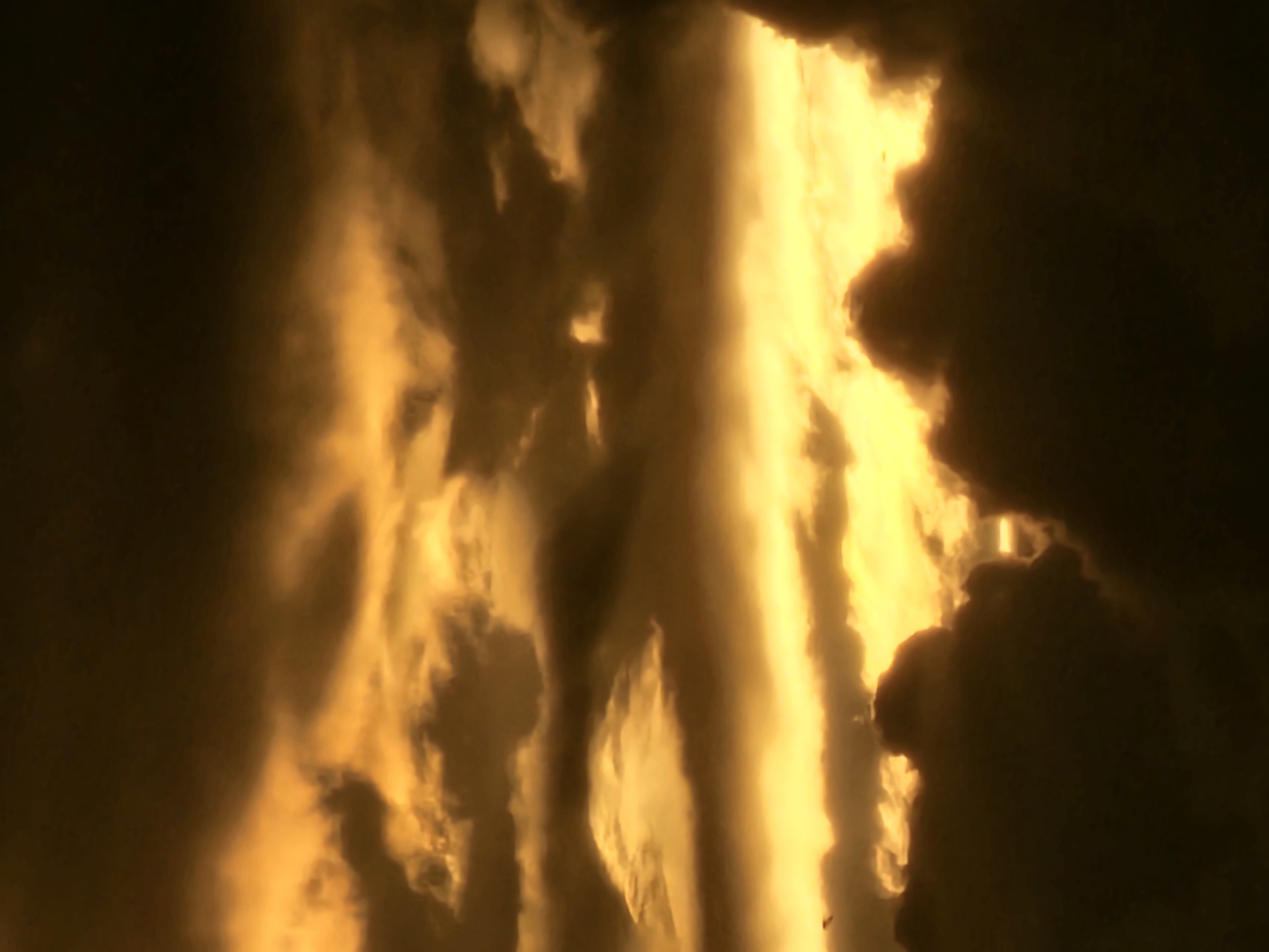 Storm clouds glow orange at the horizon over Khimki