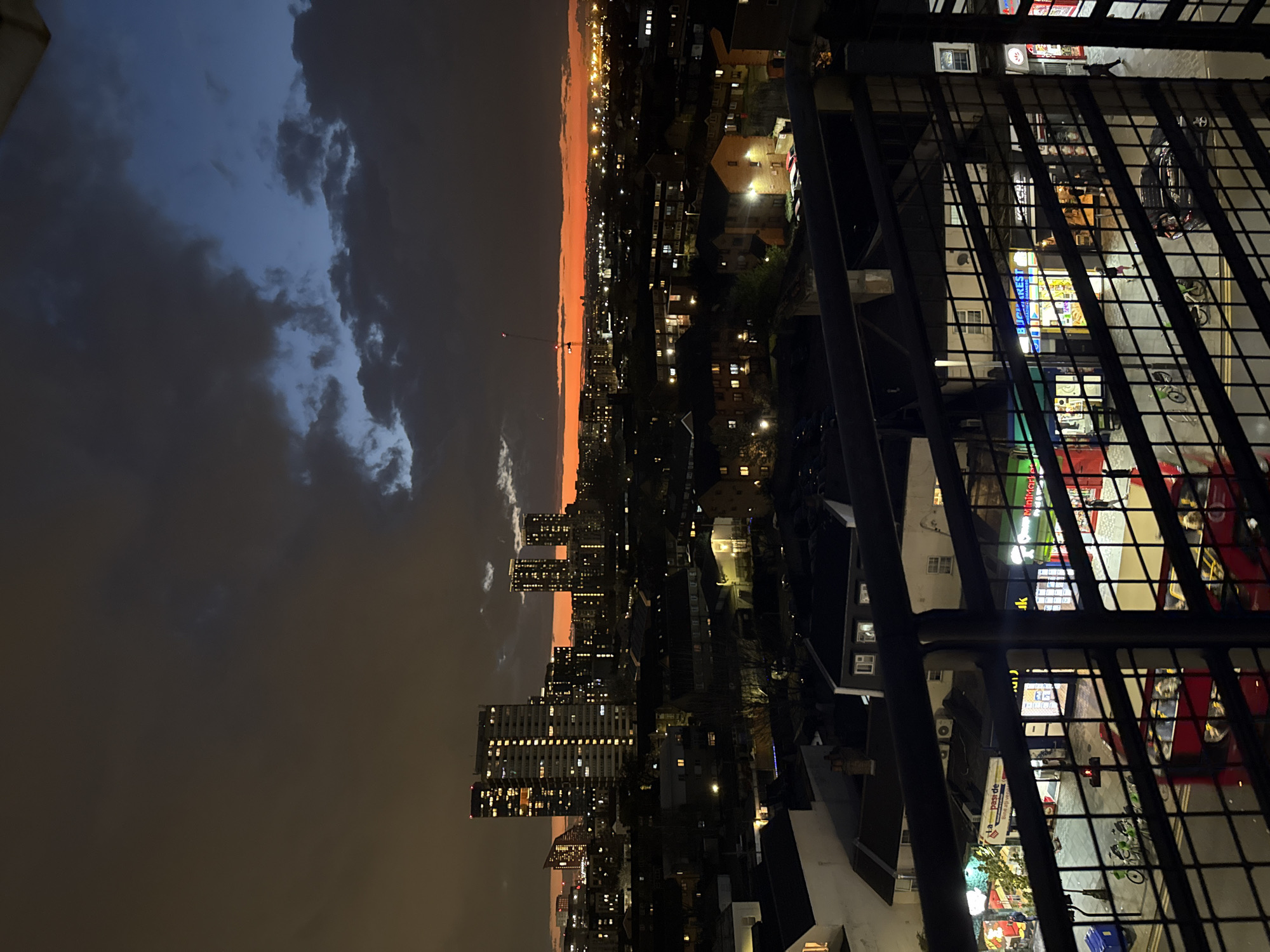 London skyline photographed from high-rise balcony at dusk