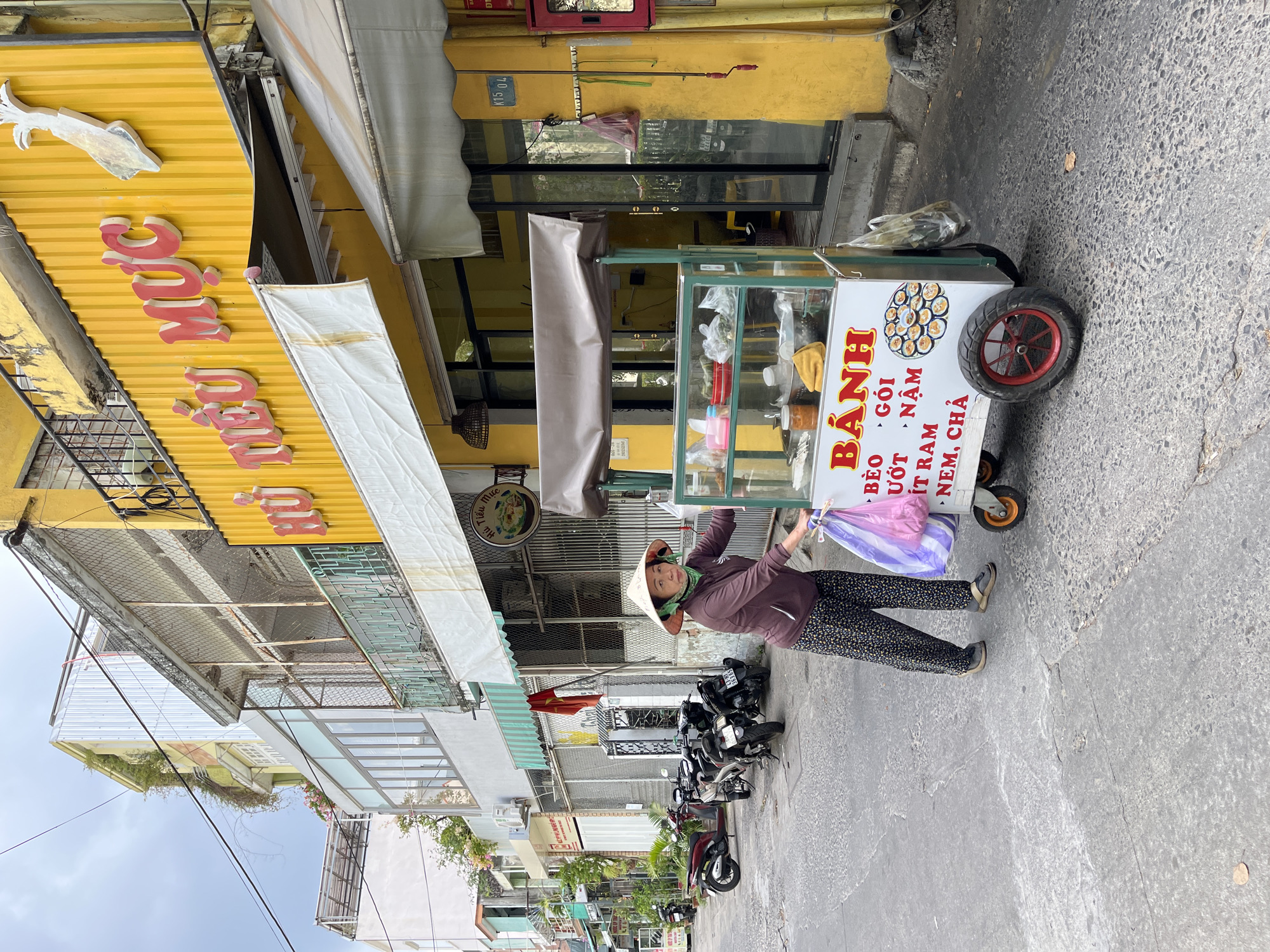 Morning street photography documents Da Nang cafes and storefronts