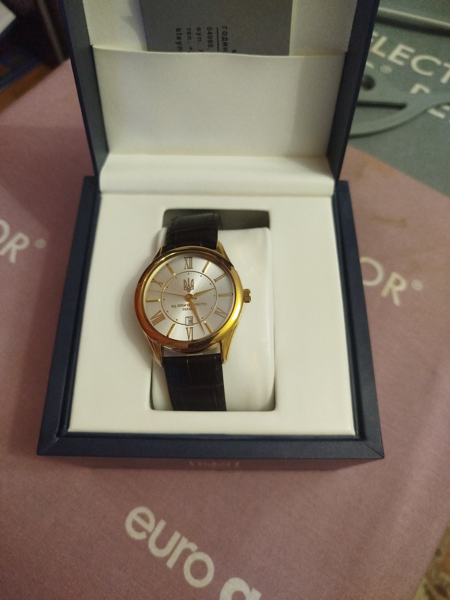 Wristwatch, orchids, and assorted objects in close-up detail shots