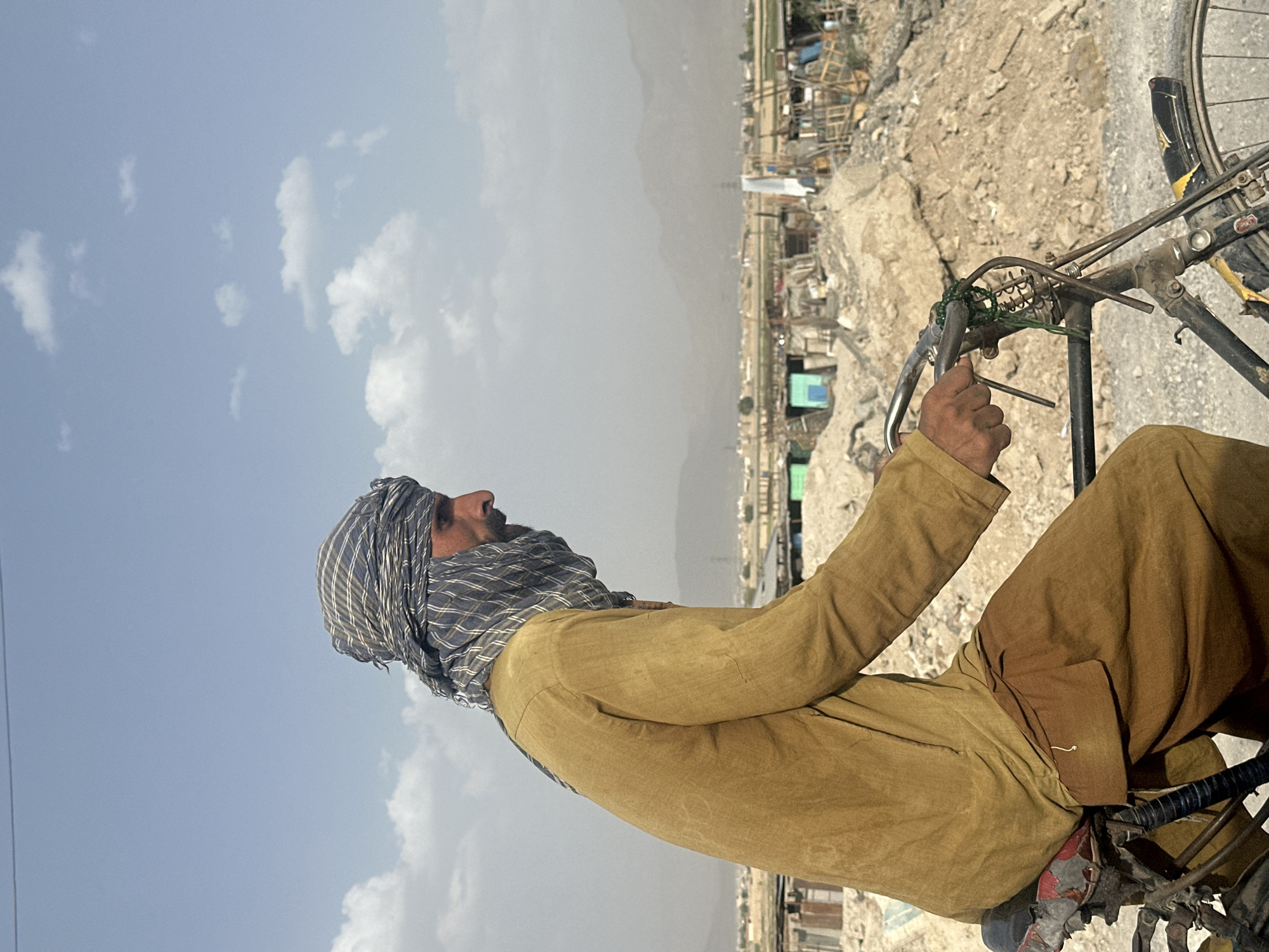Cyclist in traditional dress spotted in Quetta, Pakistan